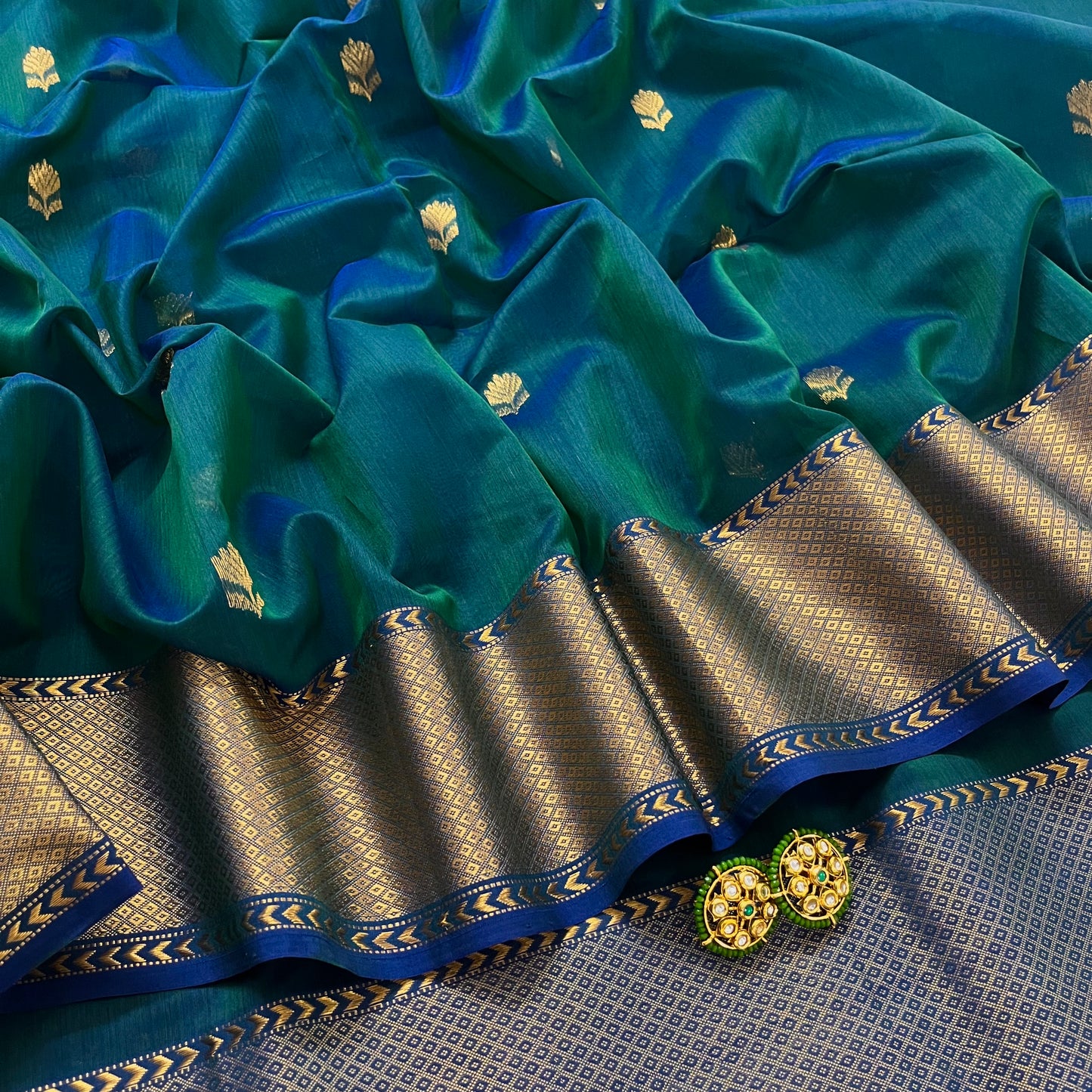 Peacock green & blue dual tone maheshwari saree with flower motifs all over