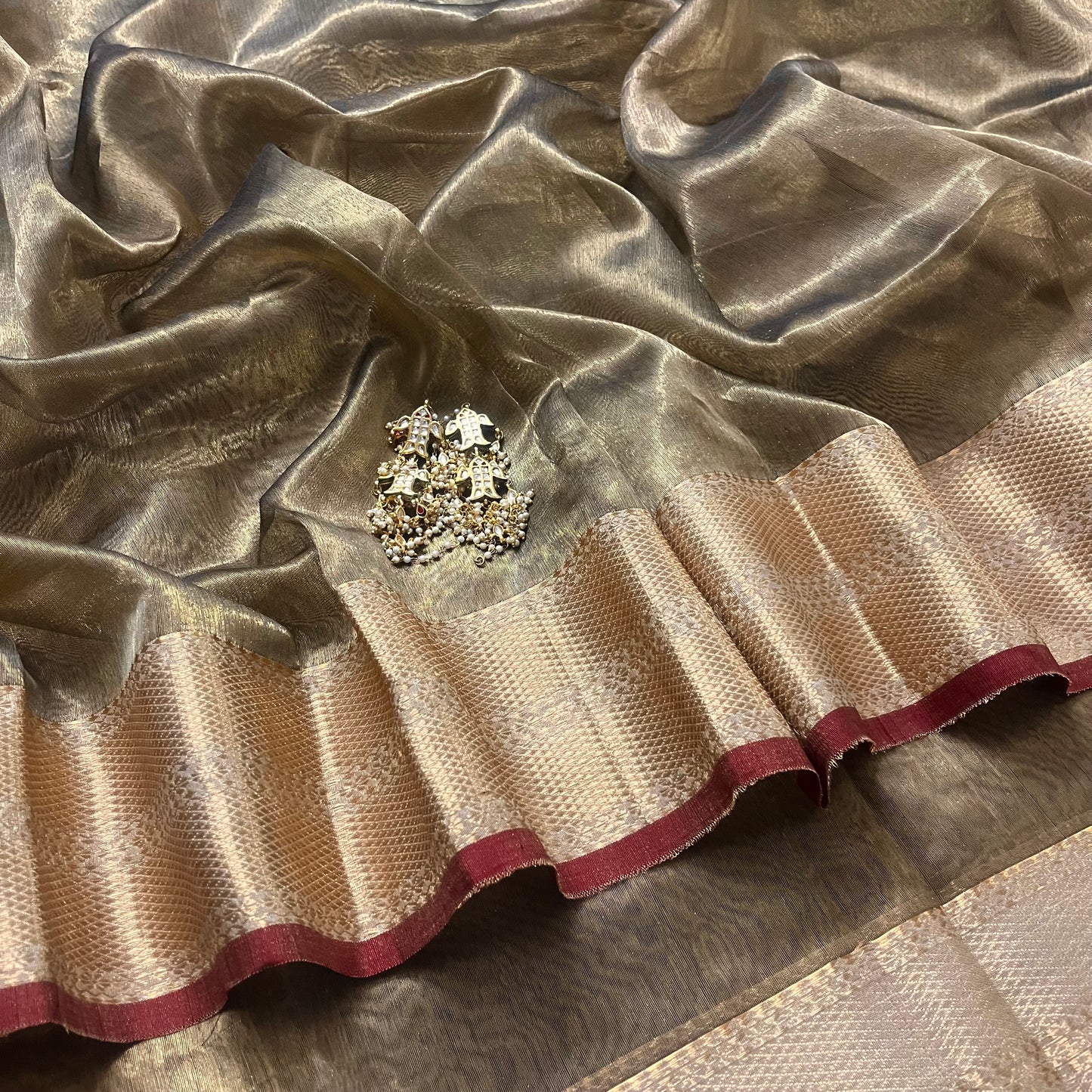 Antique gold and red Maheshwari tissue silk saree with zari pattern on pallu