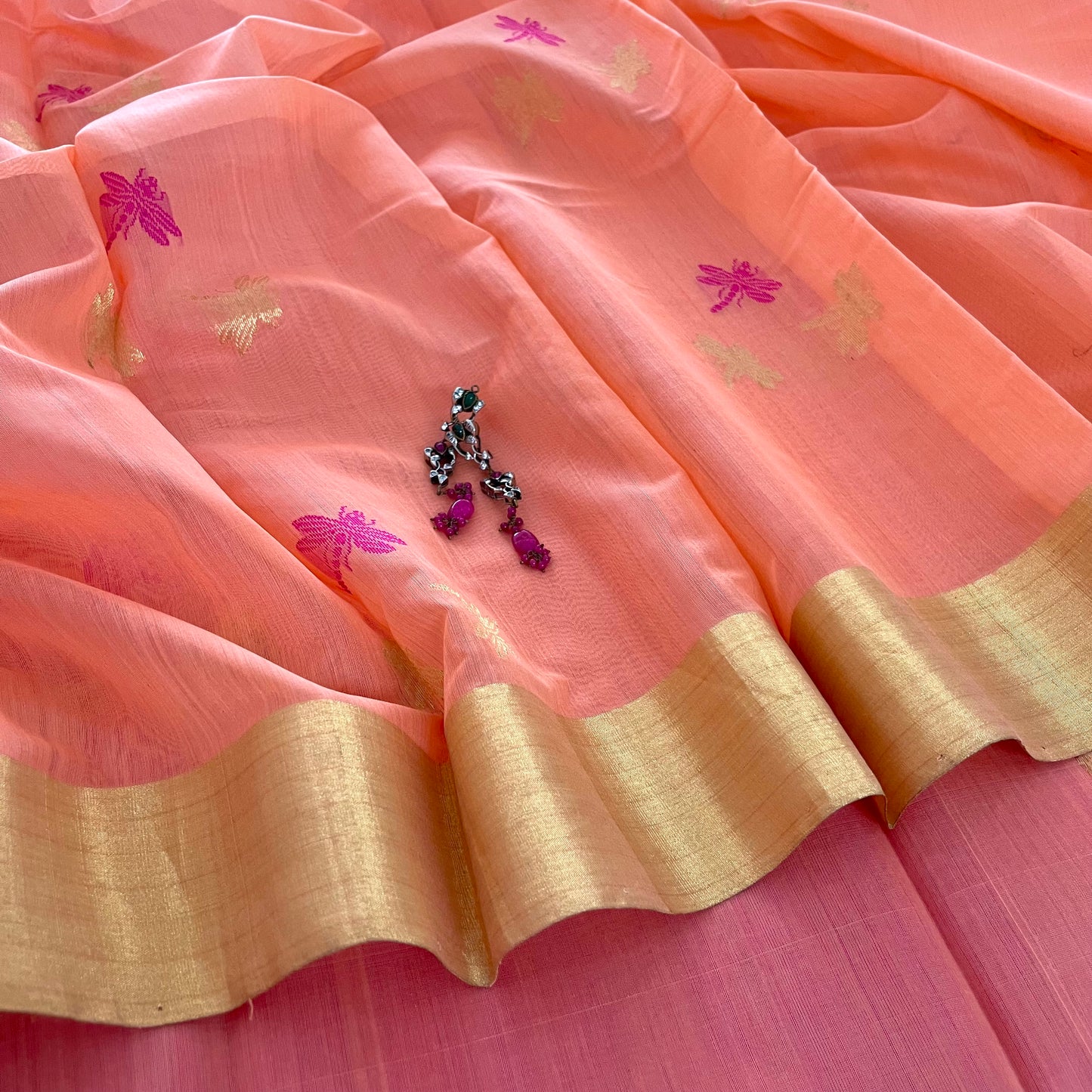 Peachish pink Chanderi silk saree with dragonfly motifs all over