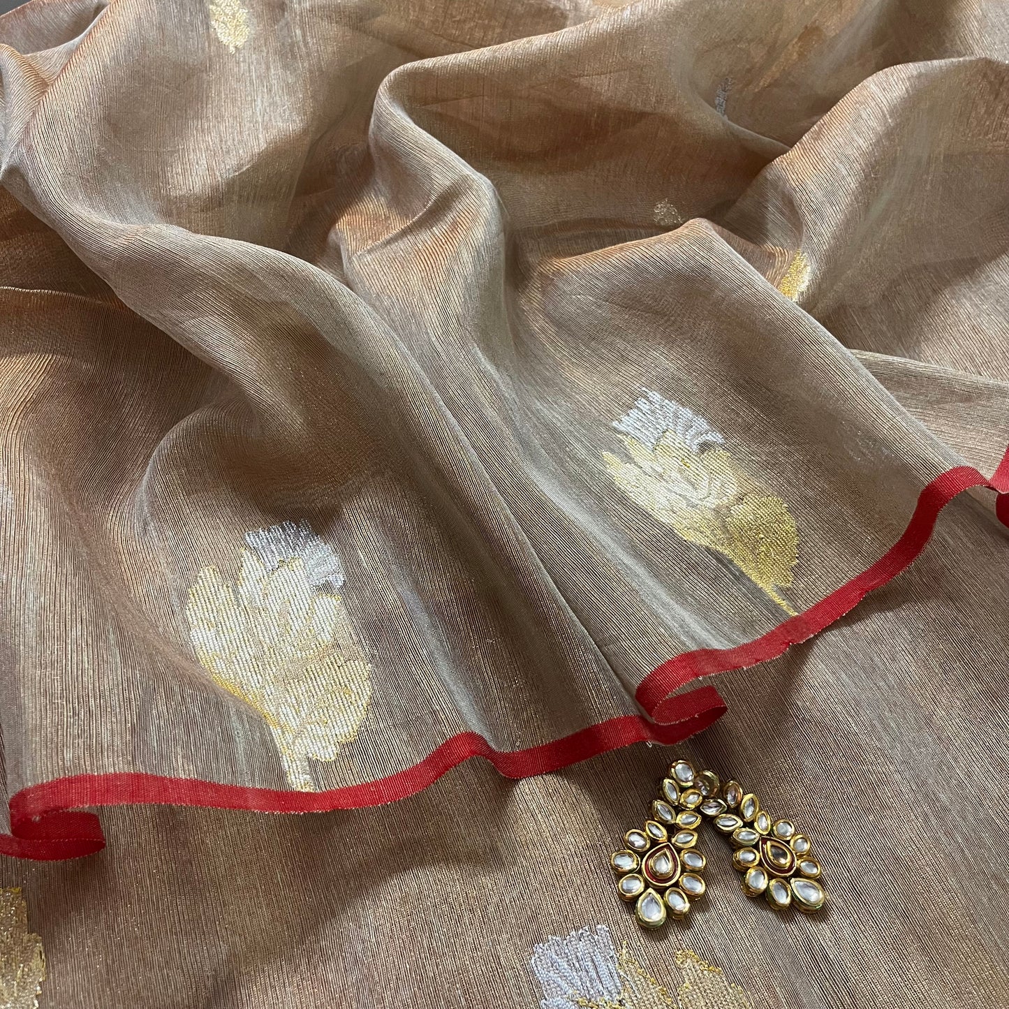 Beige and red linen saree with zari motifs all over