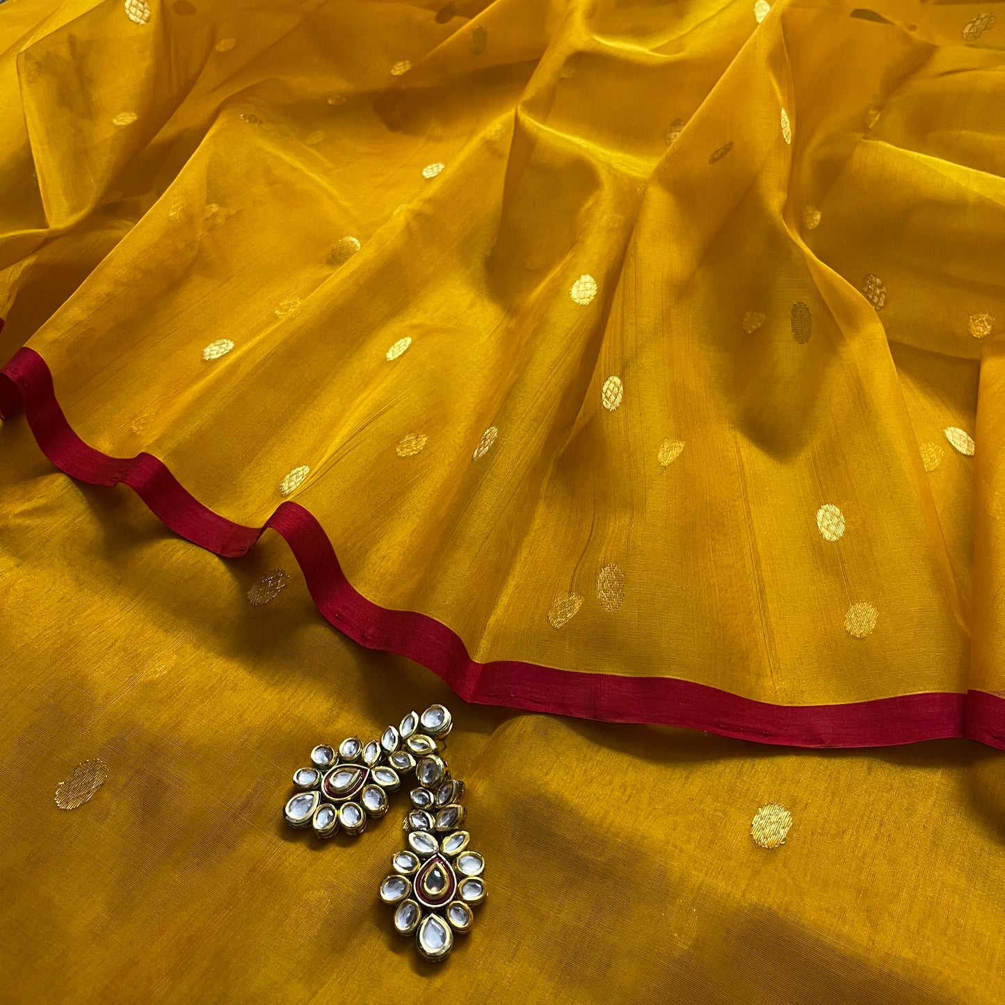Mustard red Chanderi silk saree with zari bootis all over