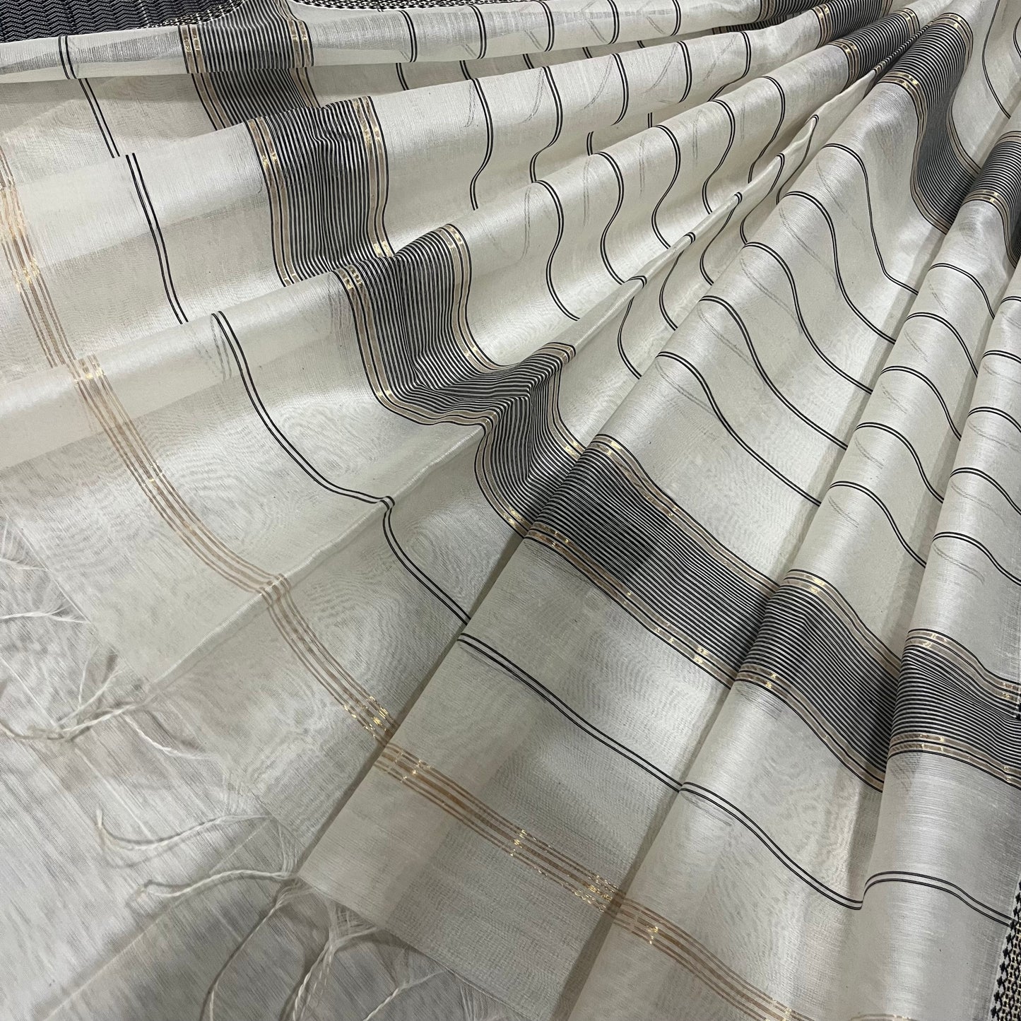 White and Black Maheshwari saree with resham border and Threadwork on pallu