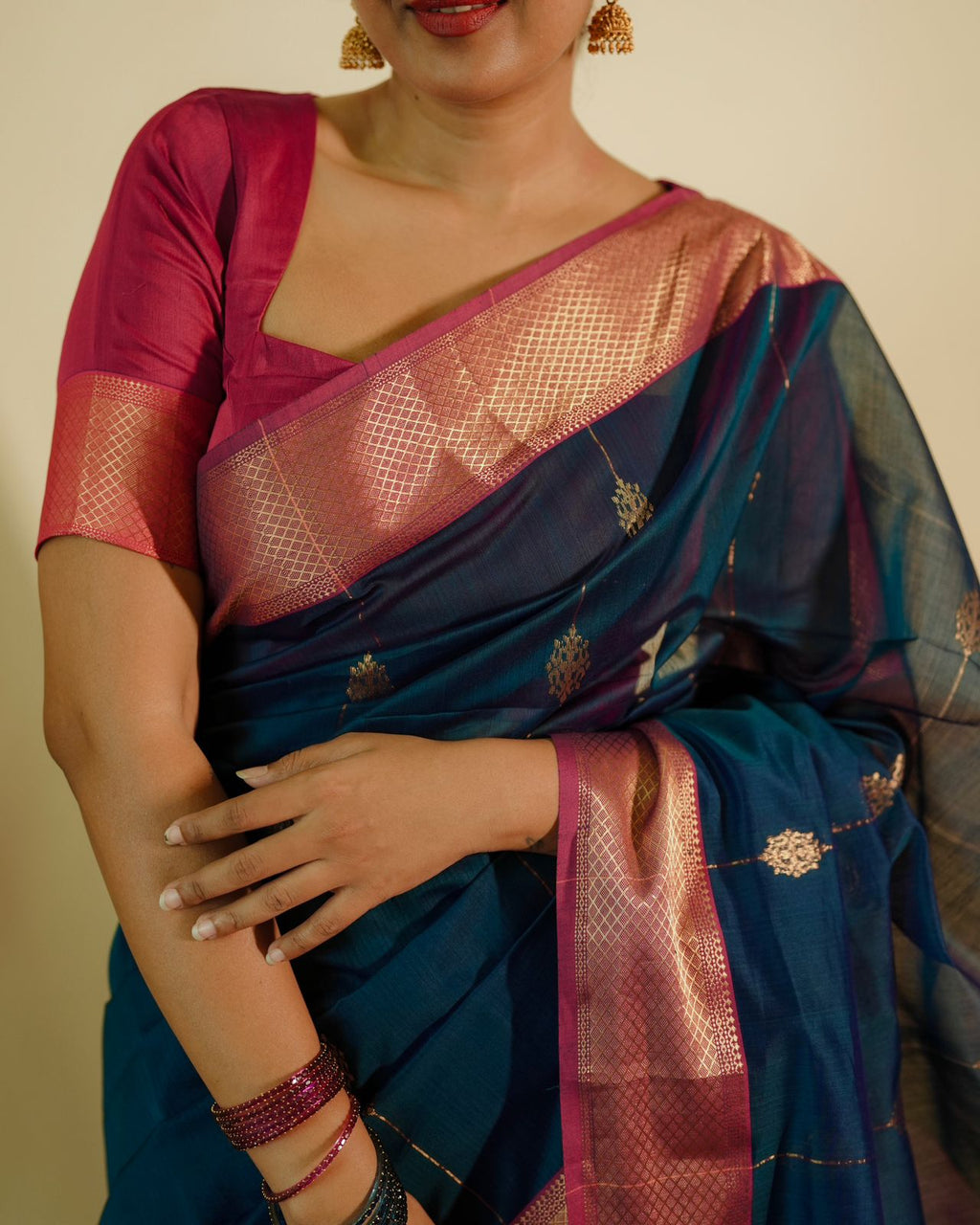 Peacock blue and pink Maheshwari saree with zari motifs all over