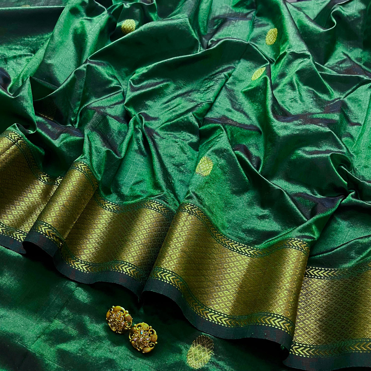 Dark green maheshwari silk saree with zari bootis all over