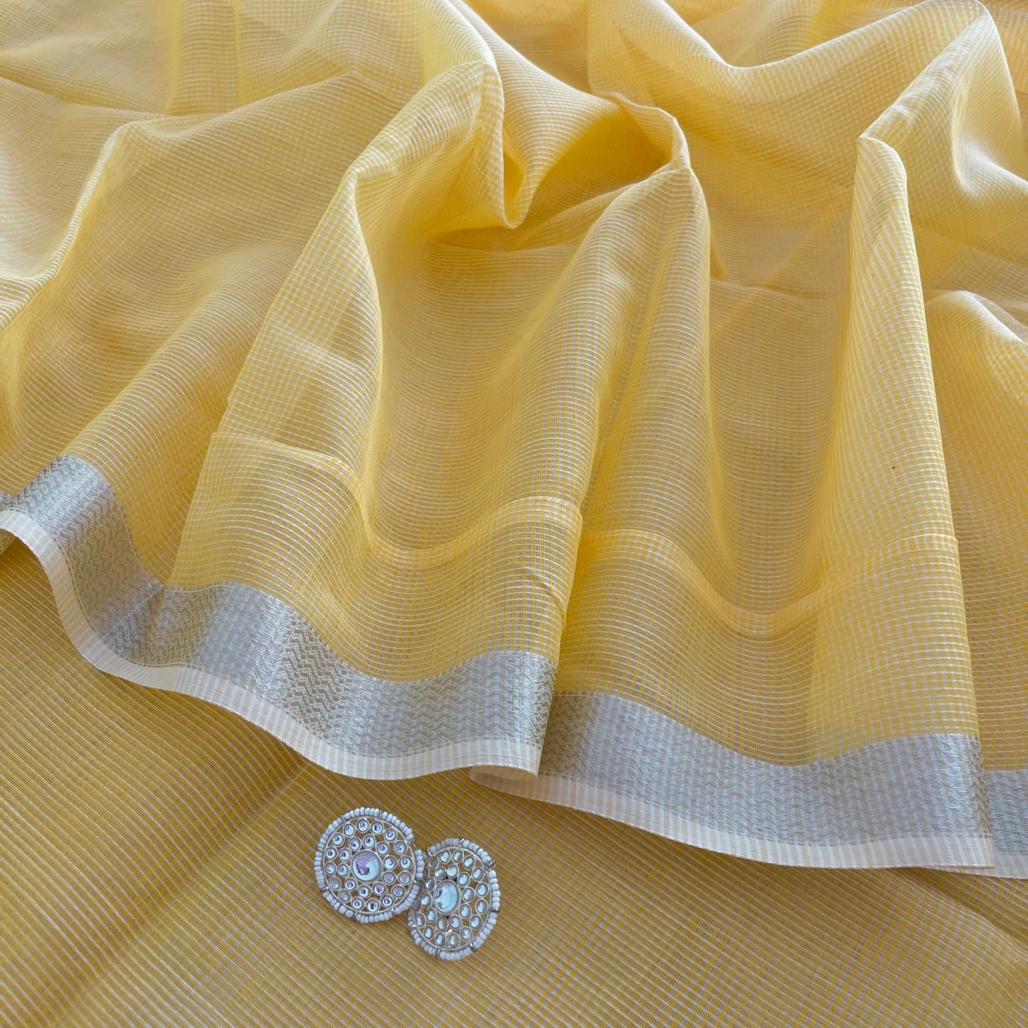 Yellow Maheshwari saree with silver zari border