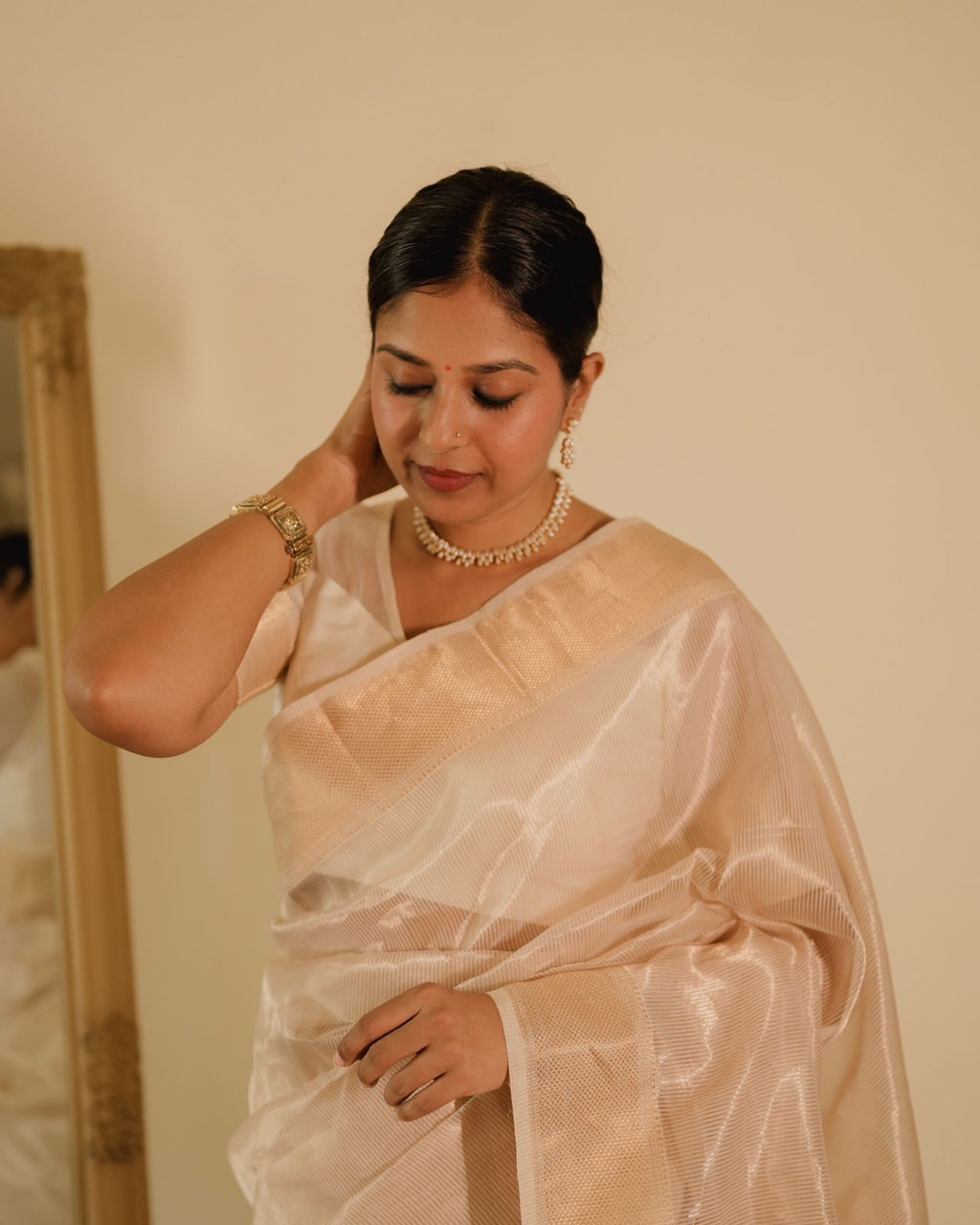 Off white gold Maheshwari saree with zari lines all over
