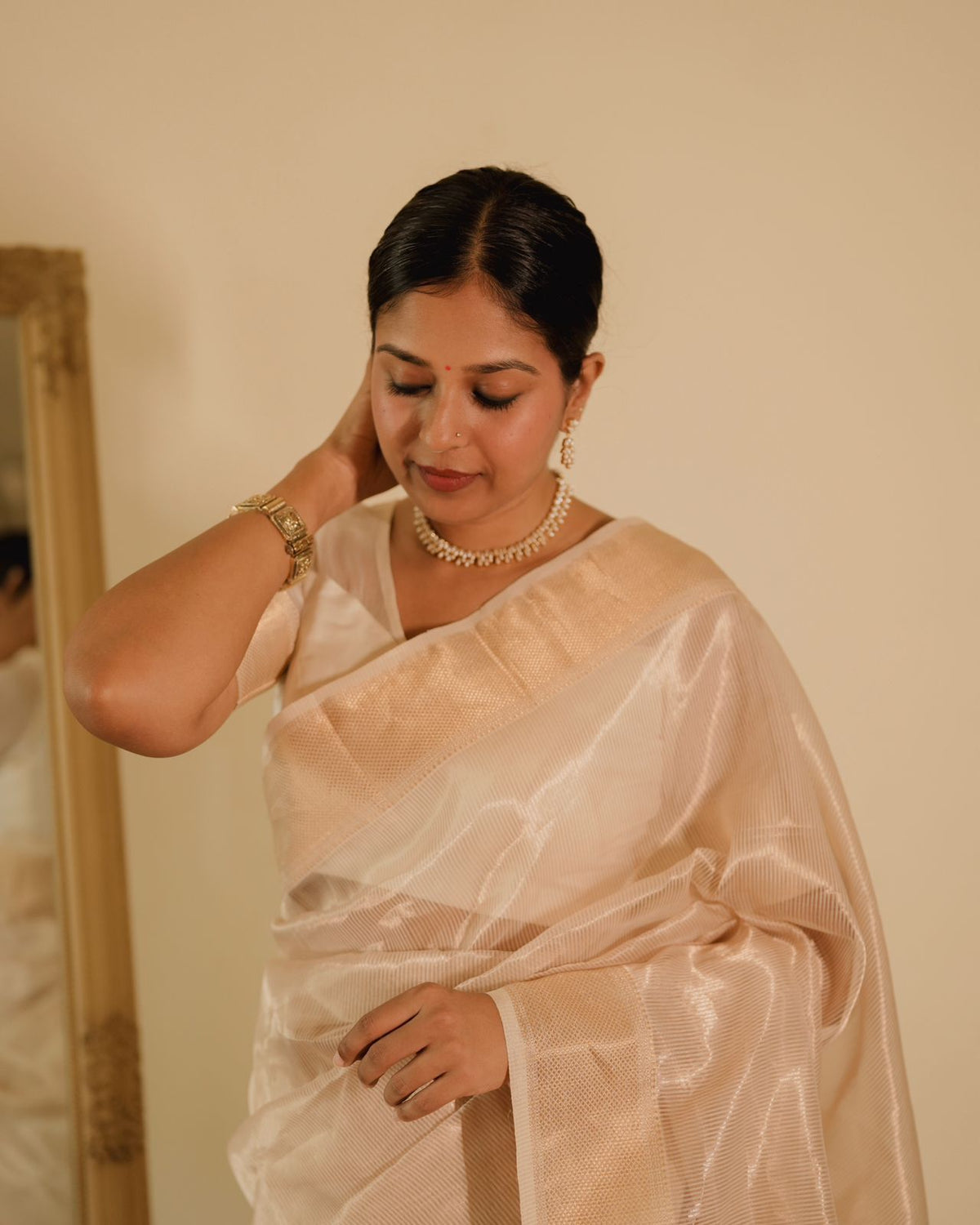 Off white gold Maheshwari saree with zari lines all over