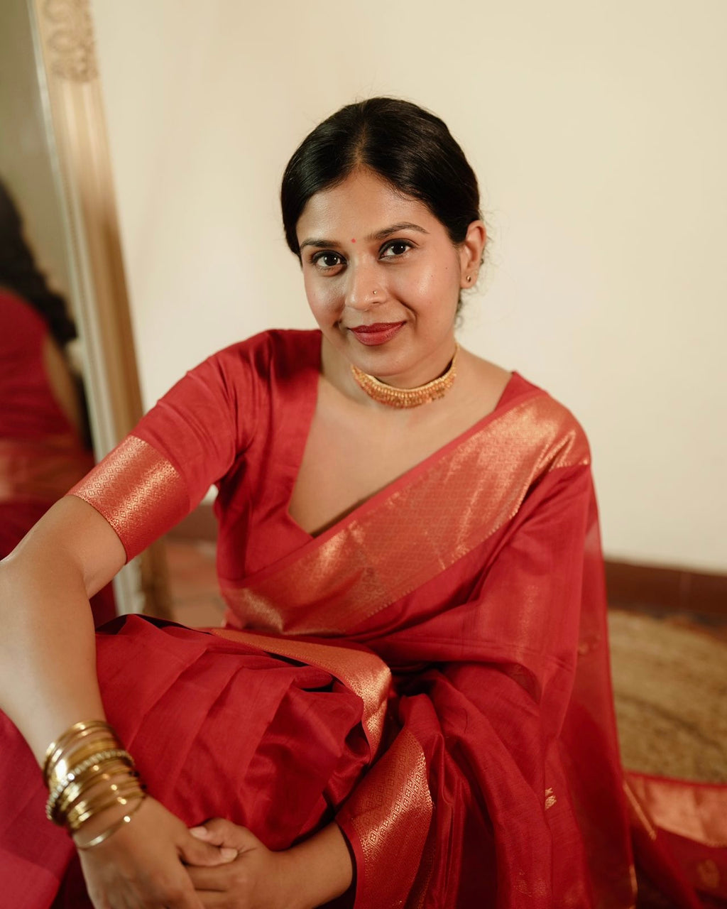 Red Maheshwari saree with morni motifs all over