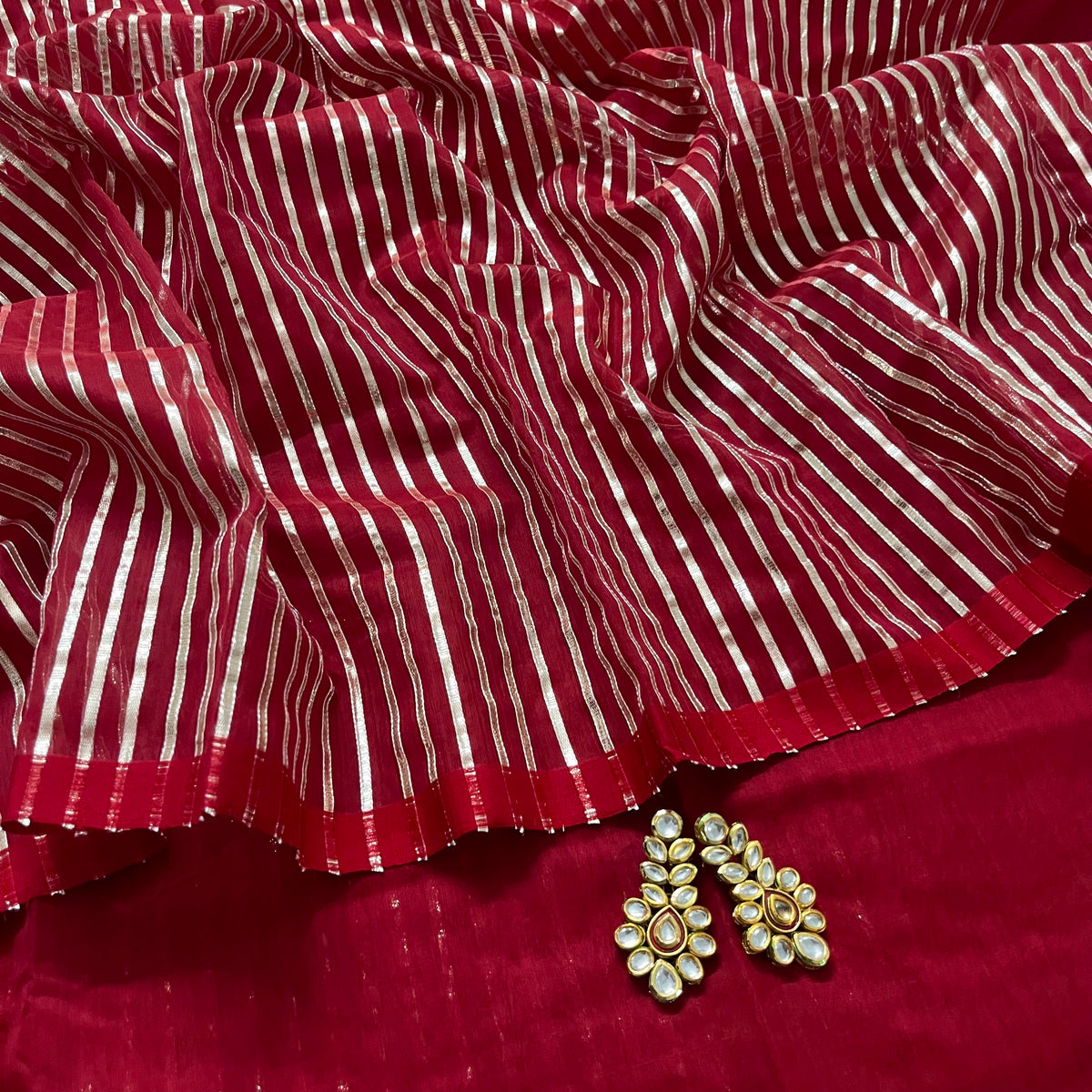 Deep red chanderi saree with intricate gota work all over