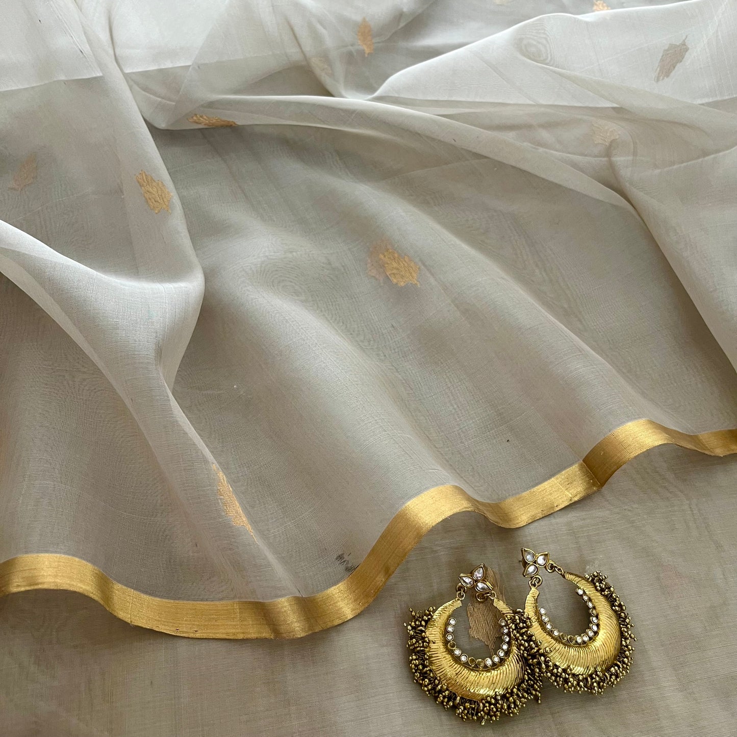Light grey Chanderi organza silk saree with zari motifs all over