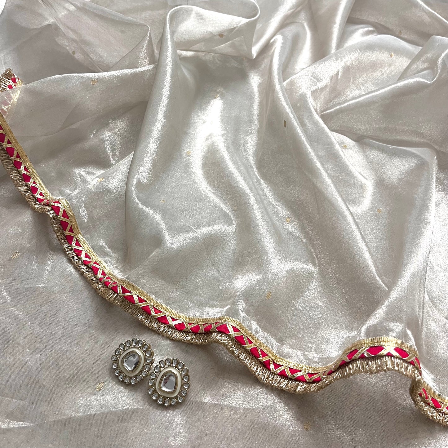 Off white and red Chanderi tissue silk saree with zari bootis all over