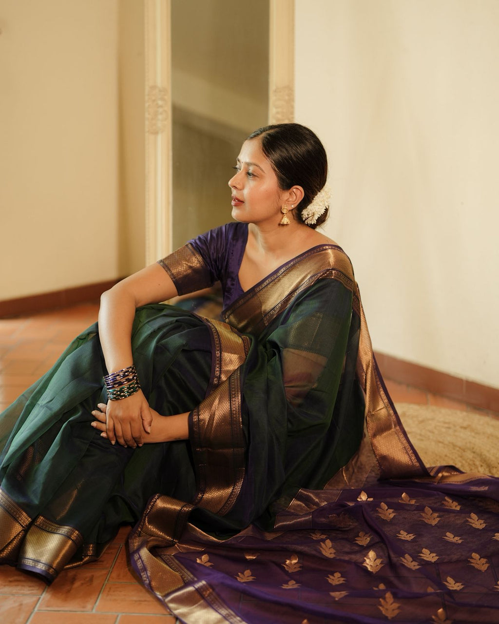 Peacock and purple dual tone Maheshwari saree with flower motifs on pallu