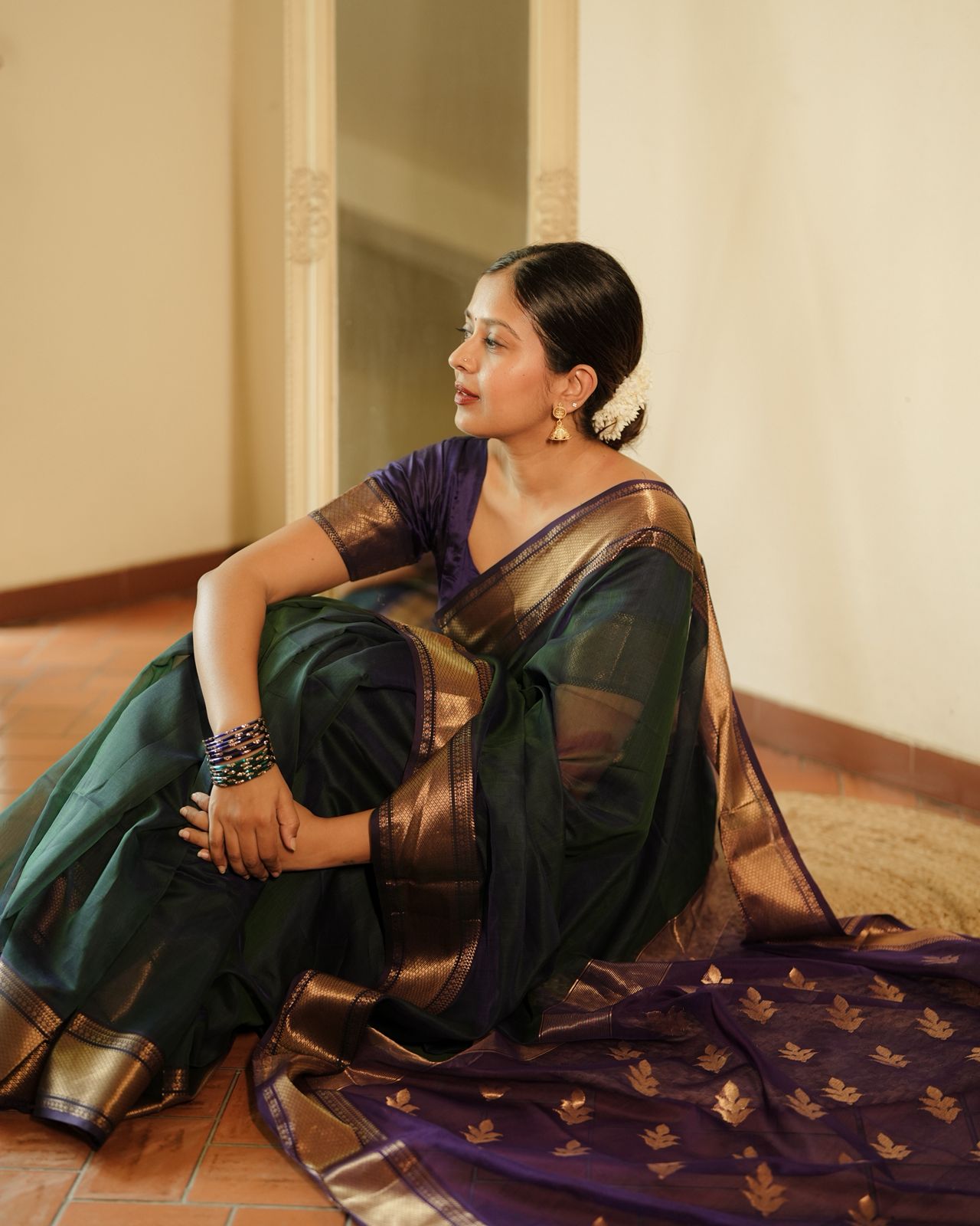 Peacock and purple dual tone Maheshwari saree with flower motifs on pallu