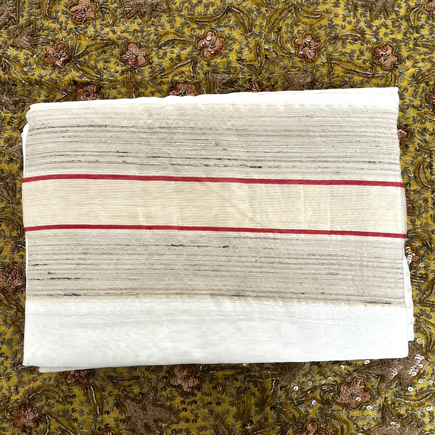 White and red Maheshwari saree with zari border