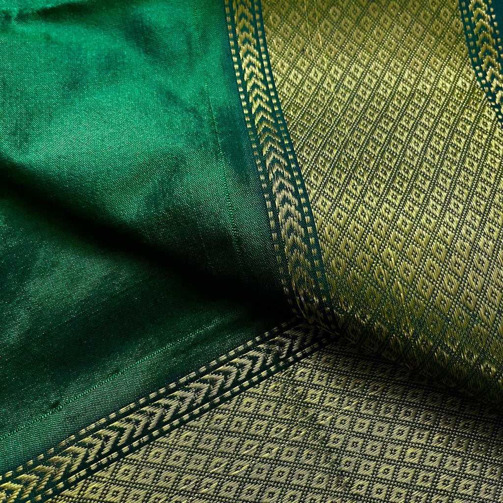 Dark green maheshwari silk saree with zari bootis all over
