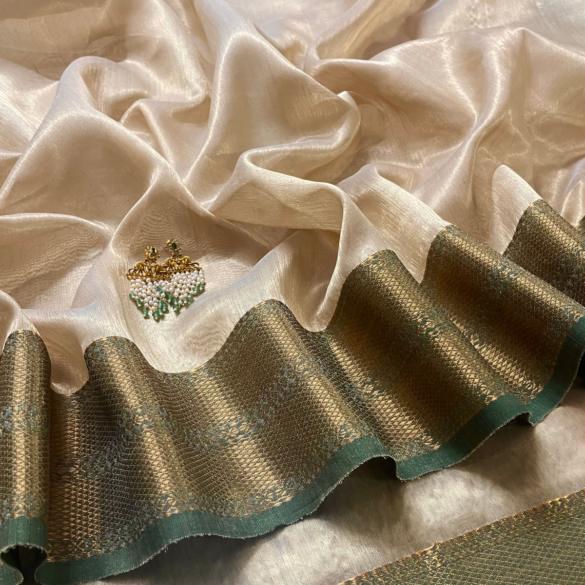 Cream Gold and green Maheshwari tissue silk saree with zari pattern on pallu
