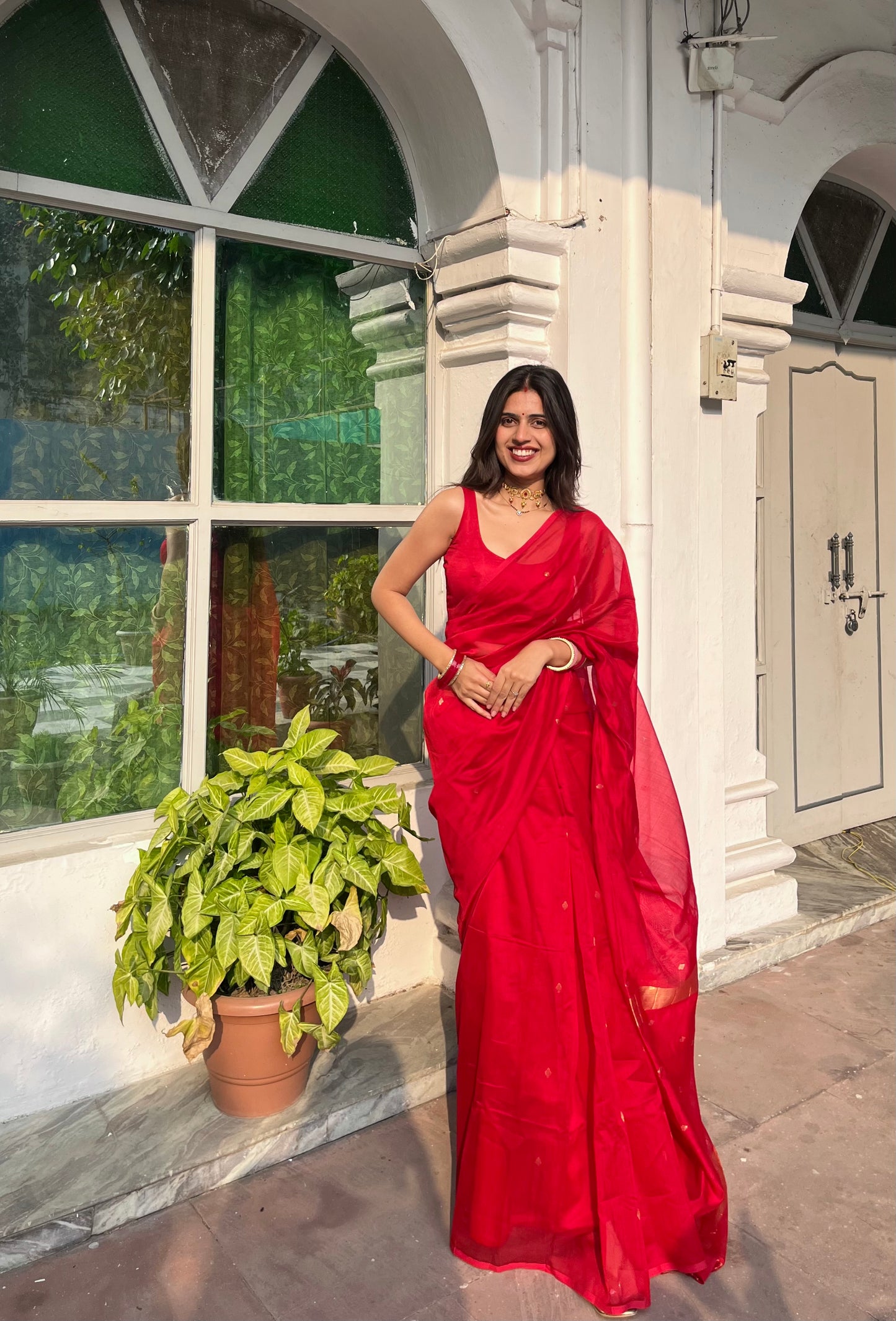 Deep red maheshwari saree with zari bootis all over