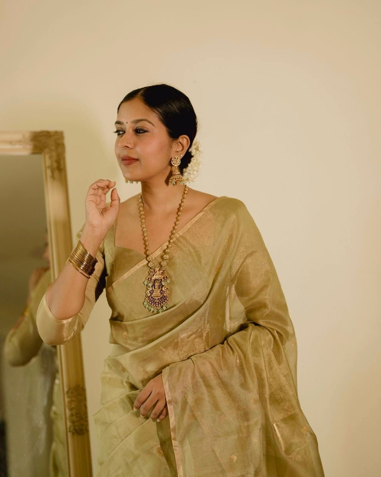 Olive gold Maheshwari tissue silk saree with zari bootis all over