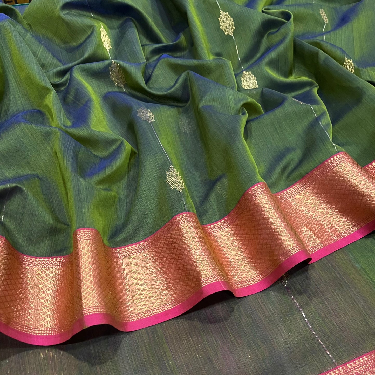 Green and pink dual tone Maheshwari saree with zari motifs all over
