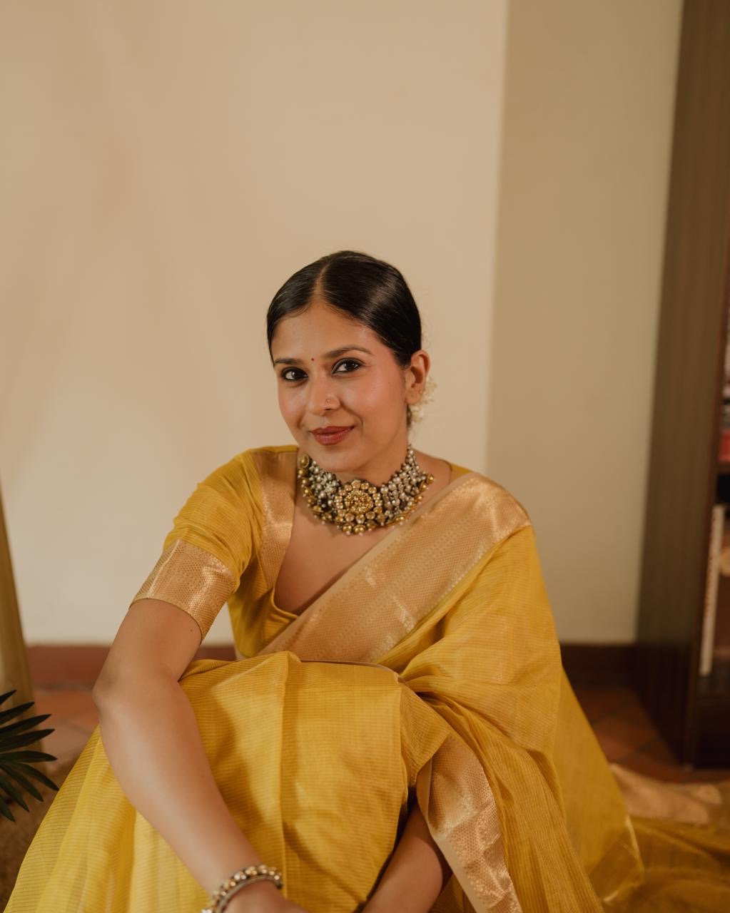 Yellow Maheshwari saree with zari lines all over