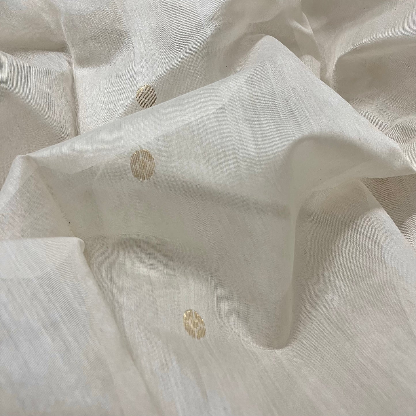 Off white Chanderi saree with zari bootis all over and zari motifs on pallu