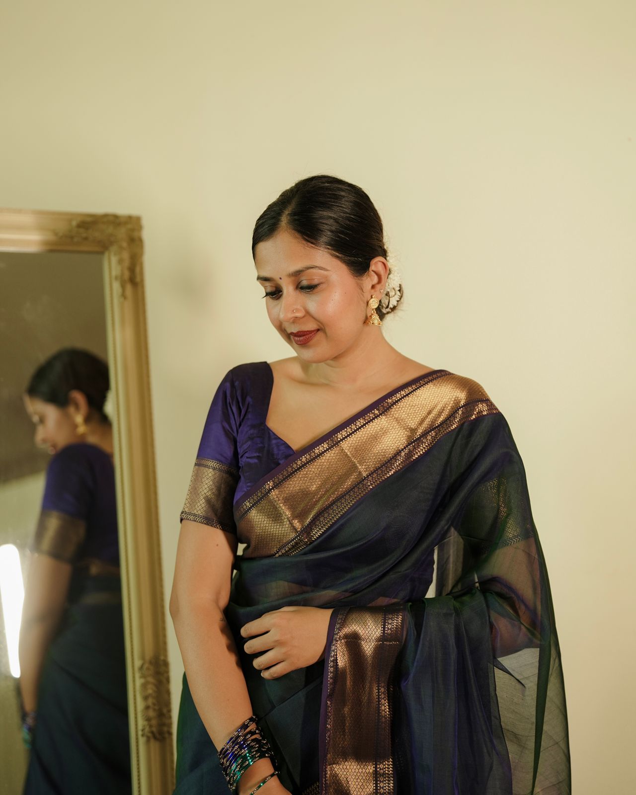 Peacock and purple dual tone Maheshwari saree with flower motifs on pallu