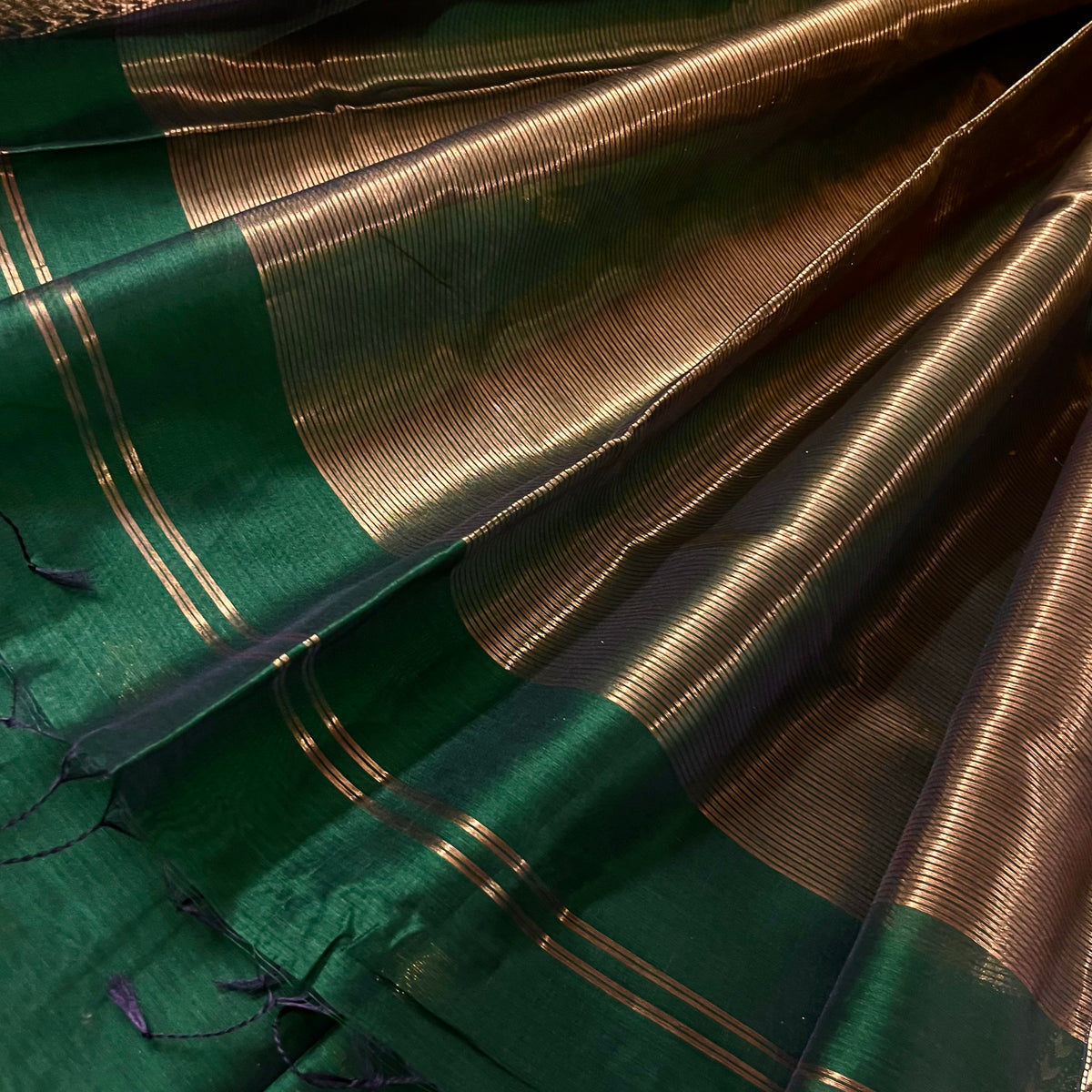 Dark green Maheshwari saree with flower motifs all over