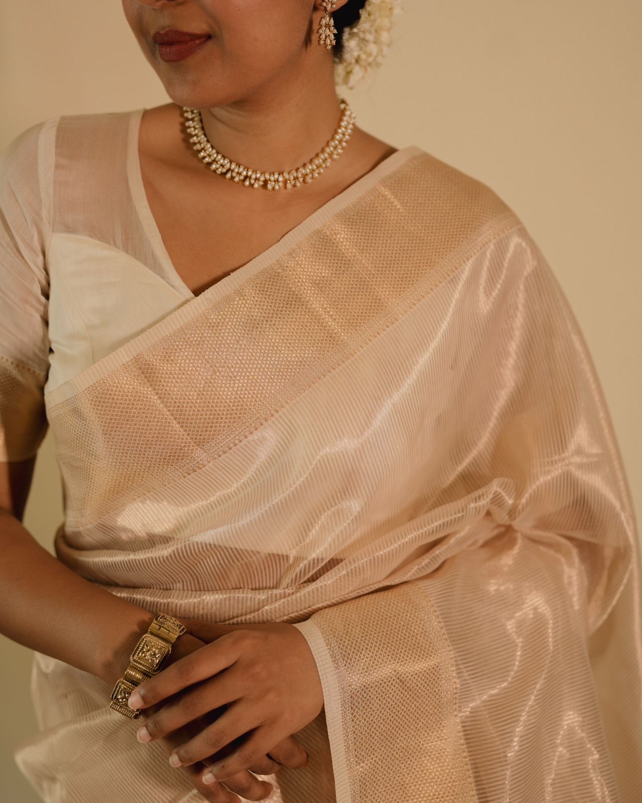 Off white gold Maheshwari saree with zari lines all over