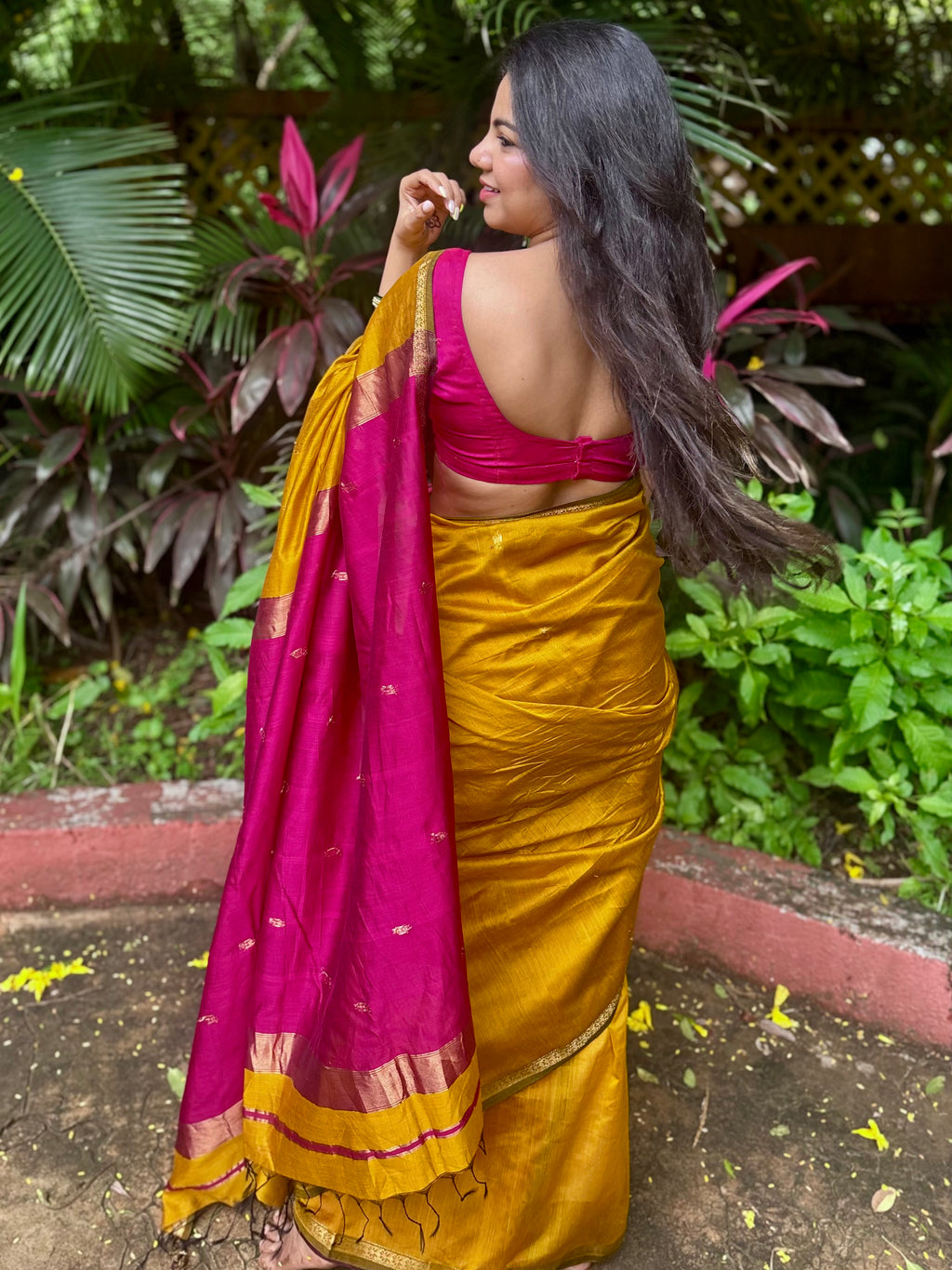 Mustard and pink maheshwari saree with flower bootis all over