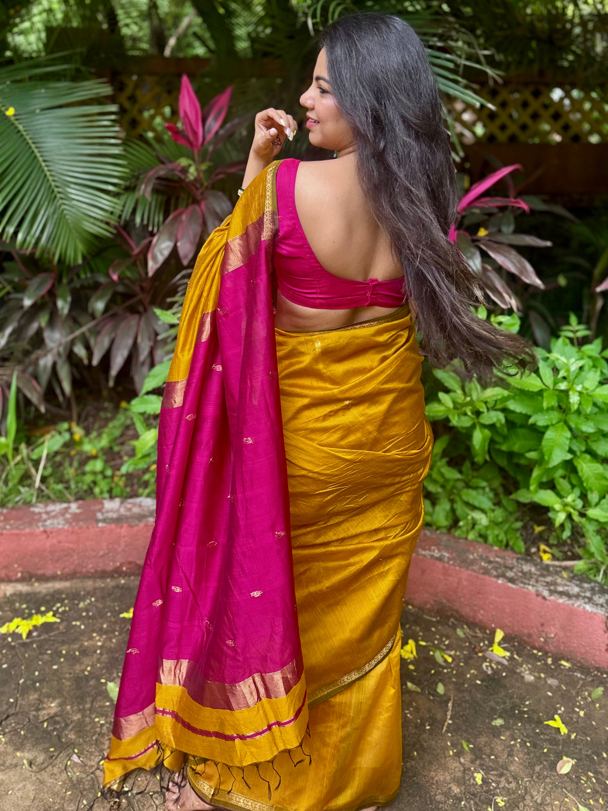 Mustard and pink maheshwari saree with flower bootis all over