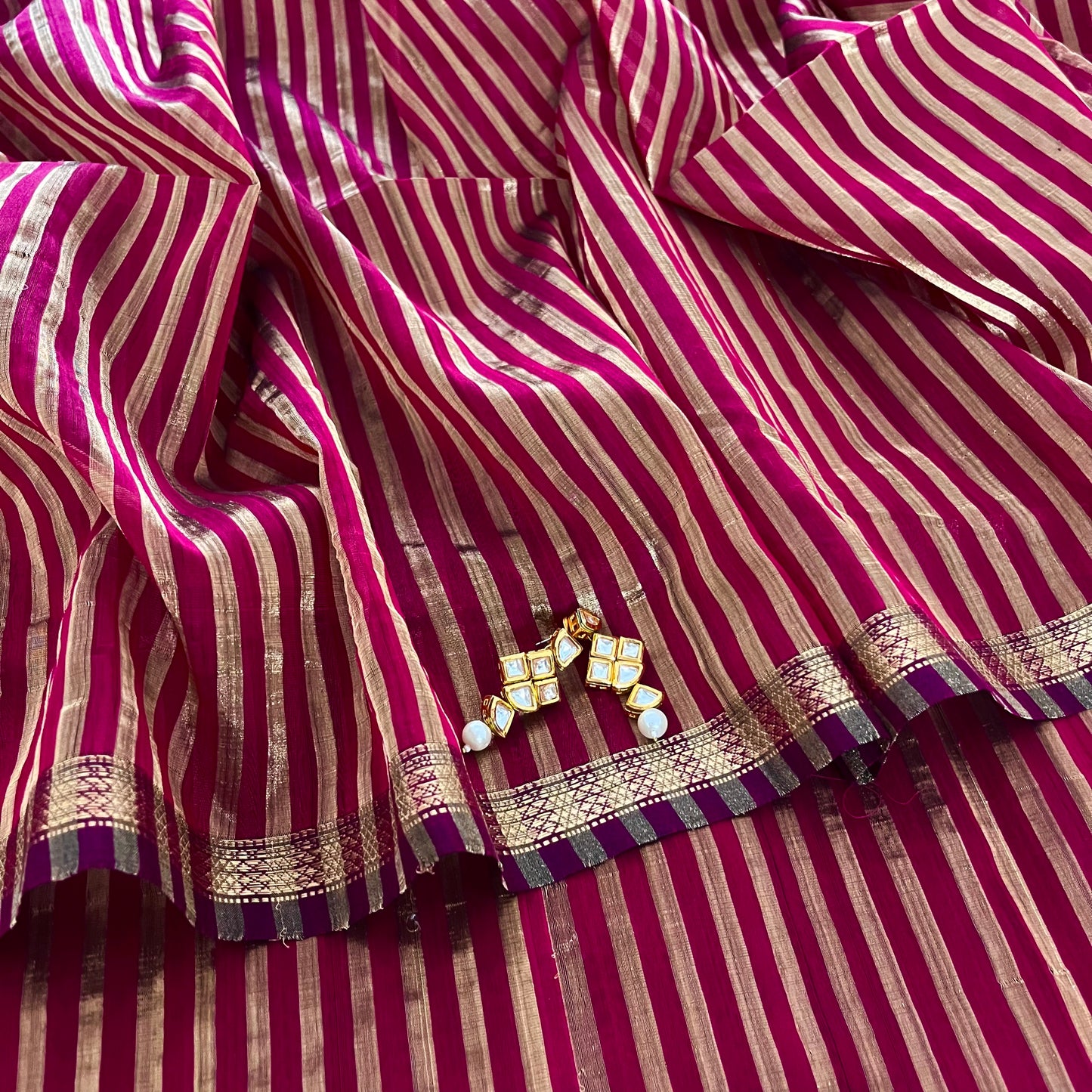 Dark pink Maheshwari saree with zari stripes all over