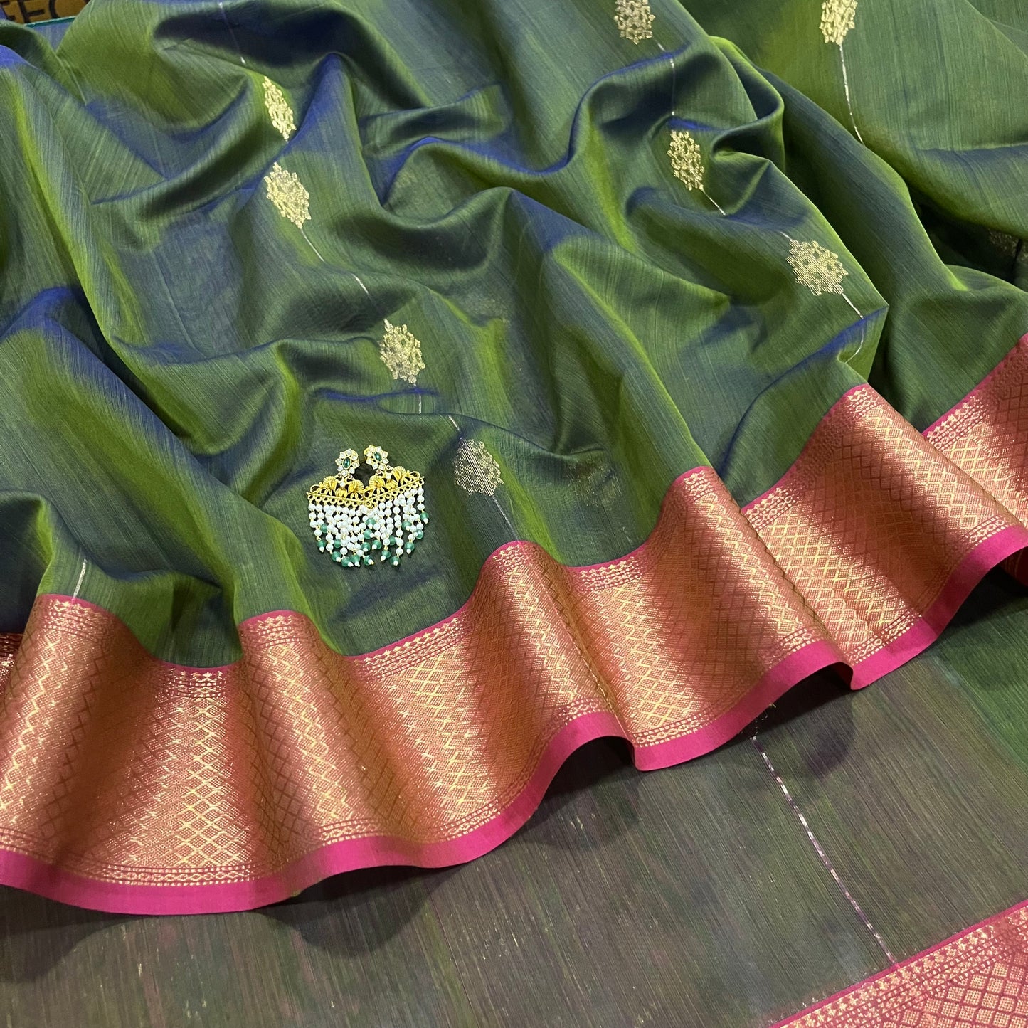 Green and pink dual tone Maheshwari saree with zari motifs all over