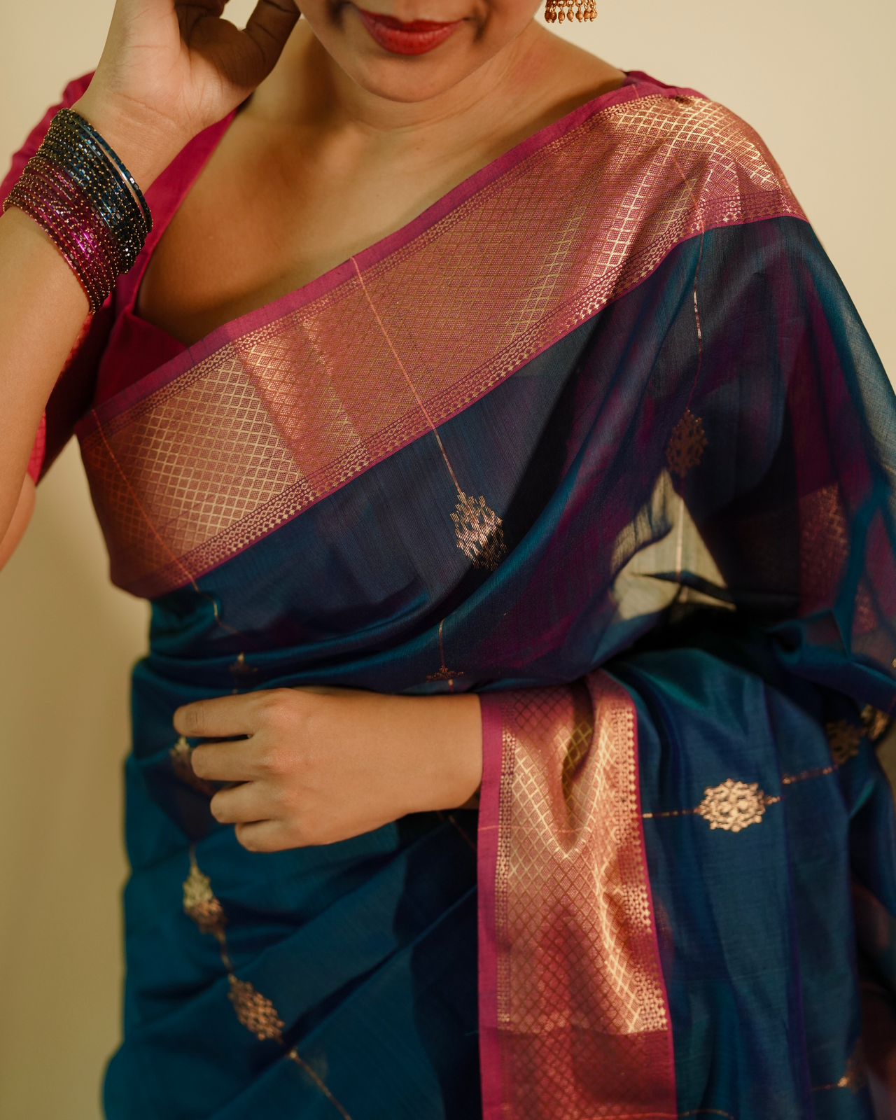 Peacock blue and pink Maheshwari saree with zari motifs all over