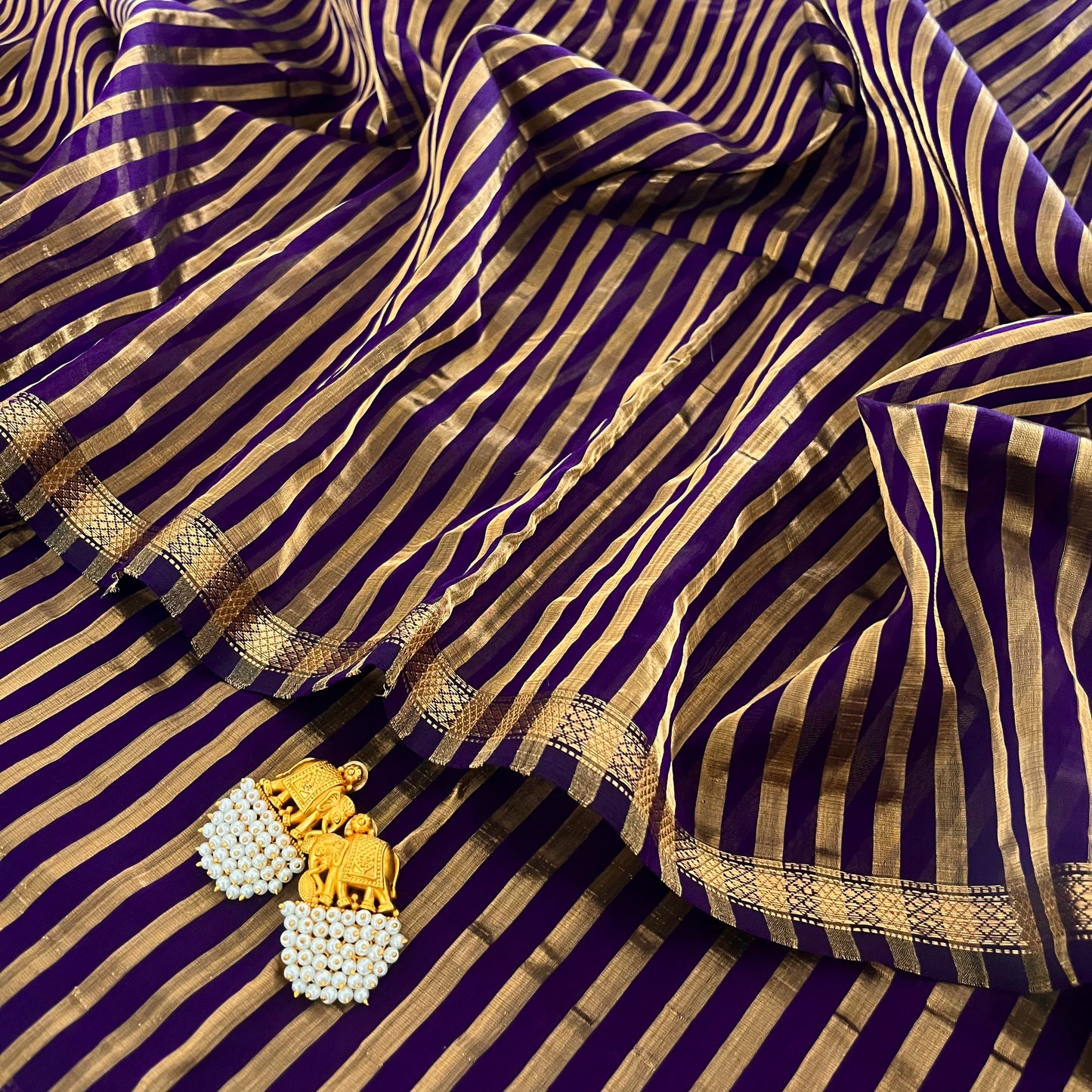Dark purple and gold Maheshwari saree with zari stripes all over