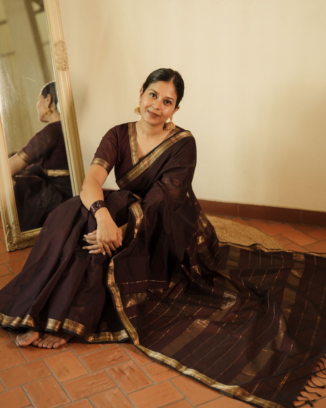 Mahoganay Maheshwari saree with zari border and zari lines on pallu