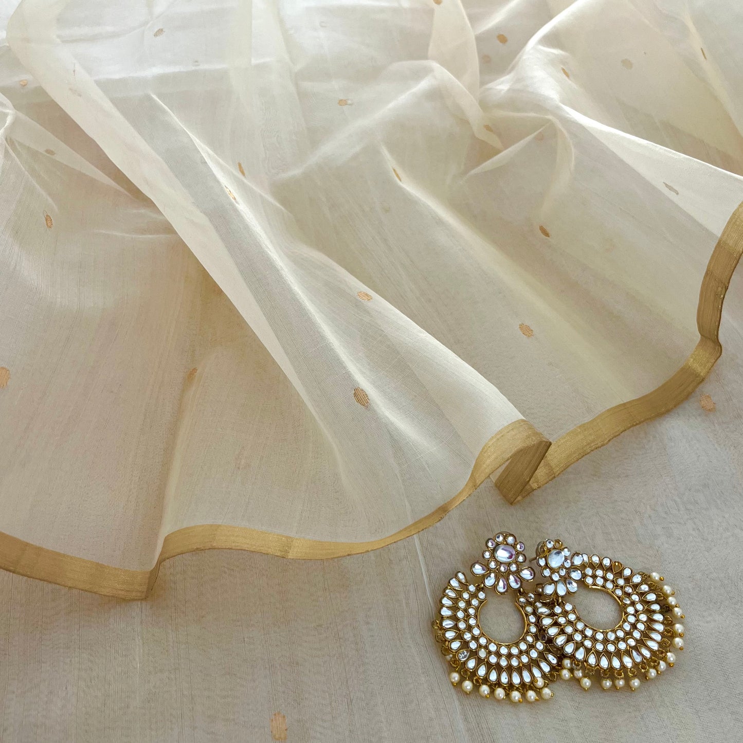 Cream Chanderi organza silk saree with zari bootis all over