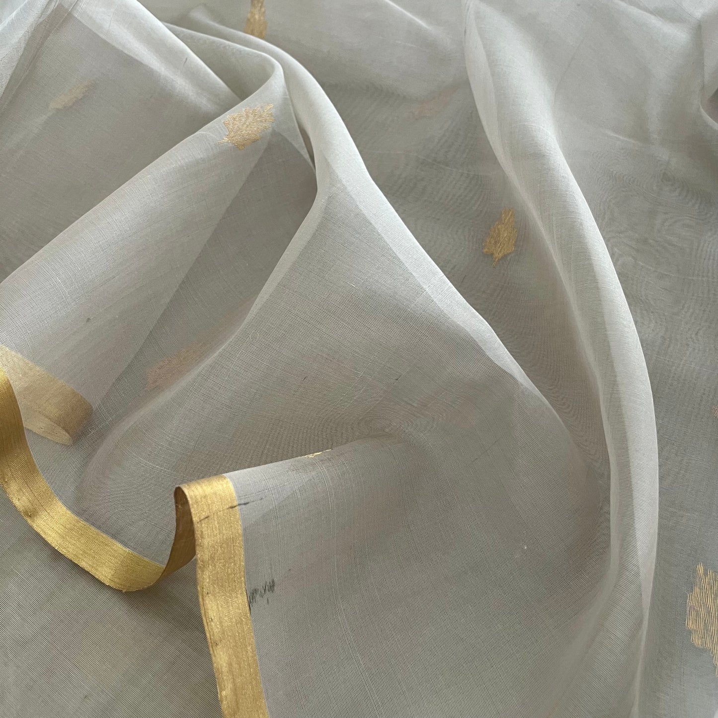Light grey Chanderi organza silk saree with zari motifs all over
