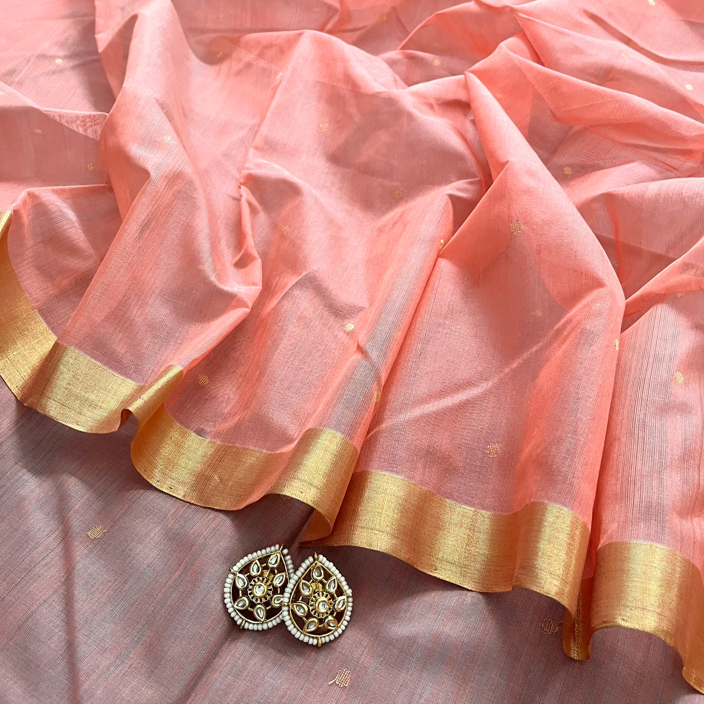 Peachish pink and blue chanderi saree with Zari bootis all over