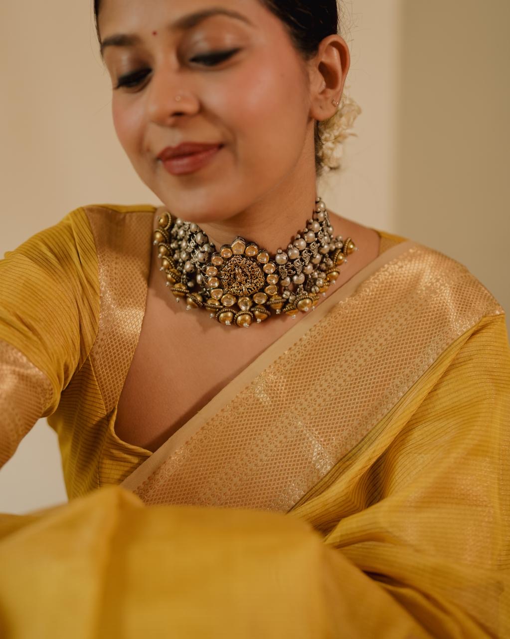 Yellow Maheshwari saree with zari lines all over