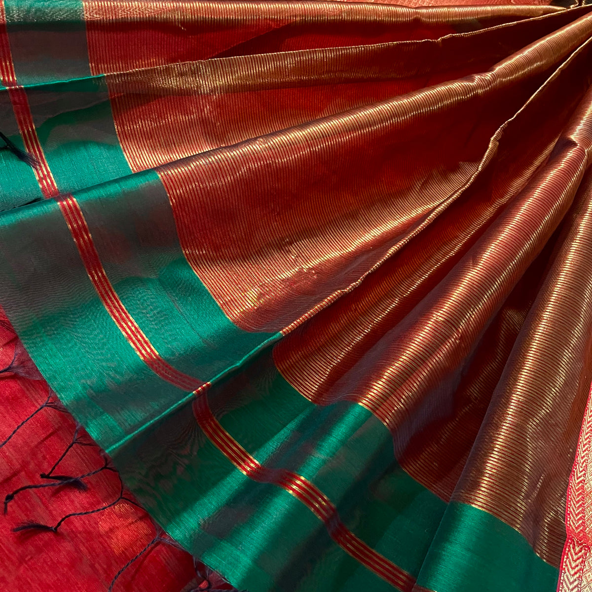 Dark green and red Maheshwari saree with flower motifs all over