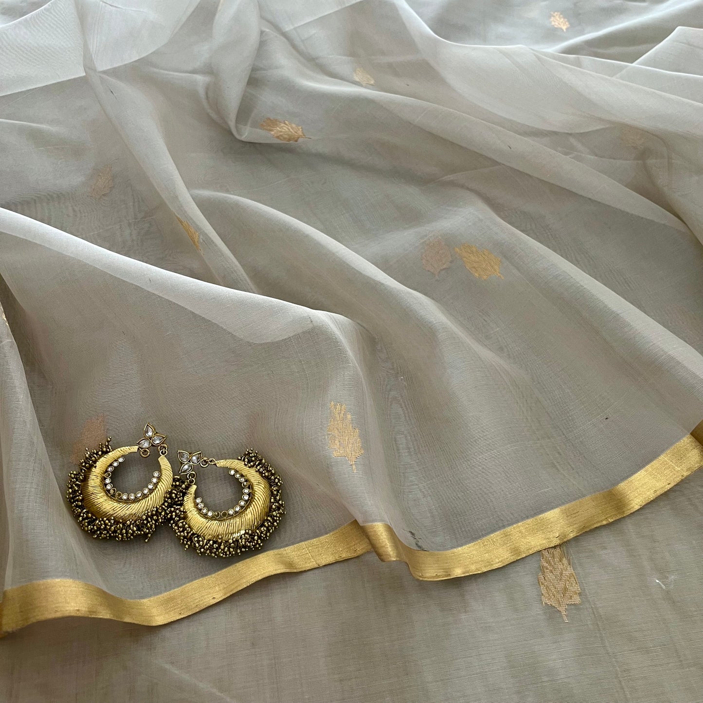 Light grey Chanderi organza silk saree with zari motifs all over