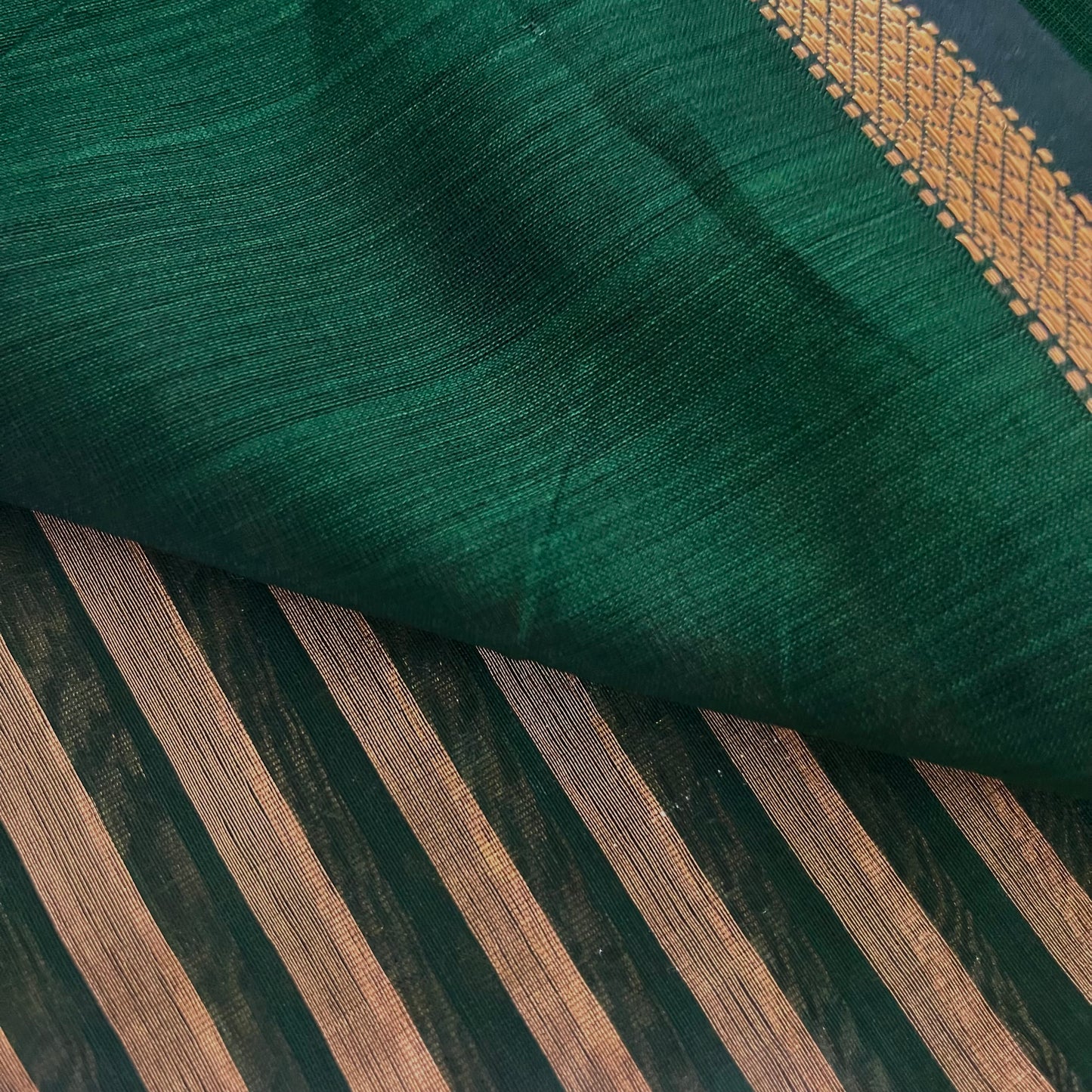 Dark green Maheshwari saree with zari stripes all over