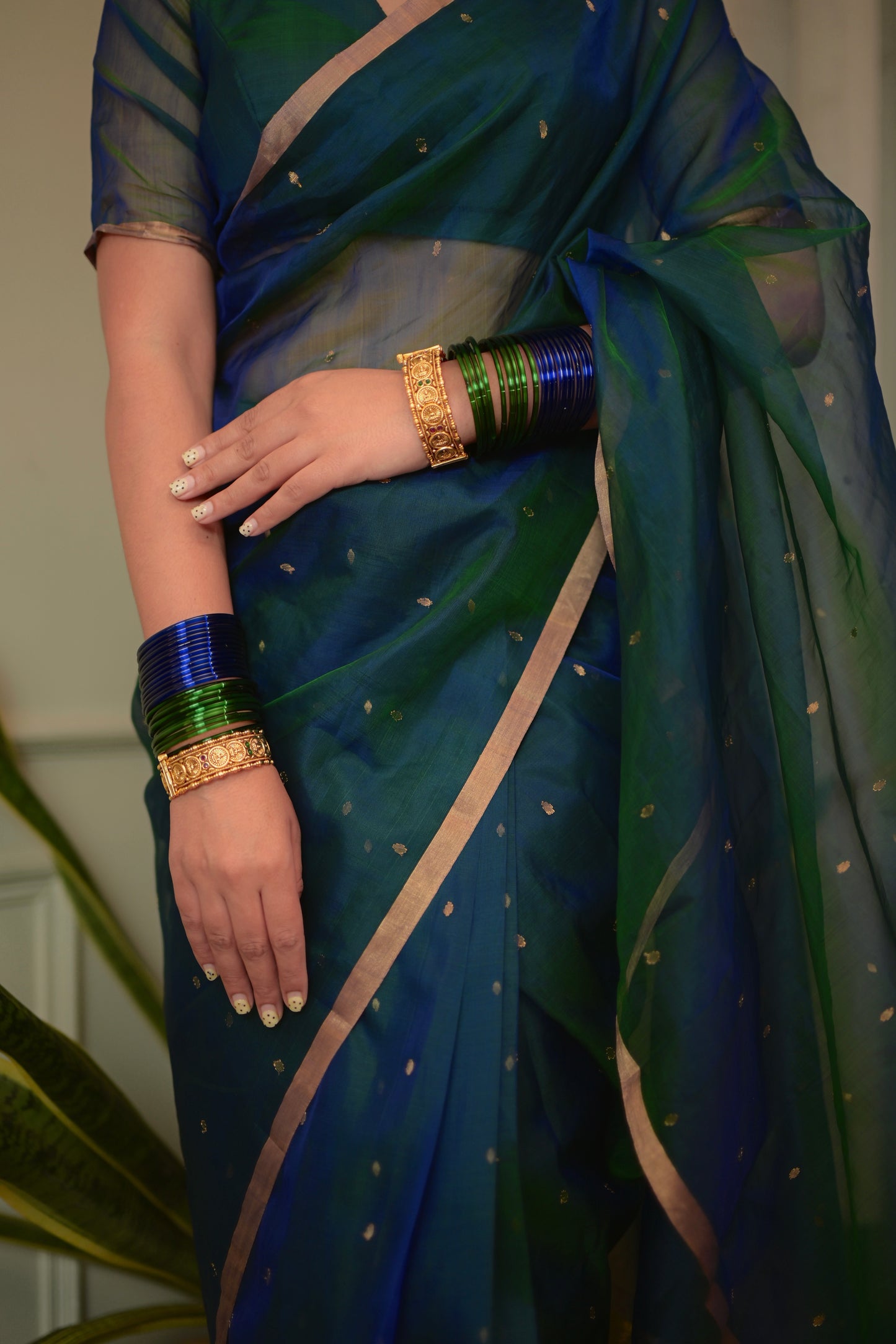 Peacock blue and green dual tone Chanderi organza silk saree with zari bootis all over