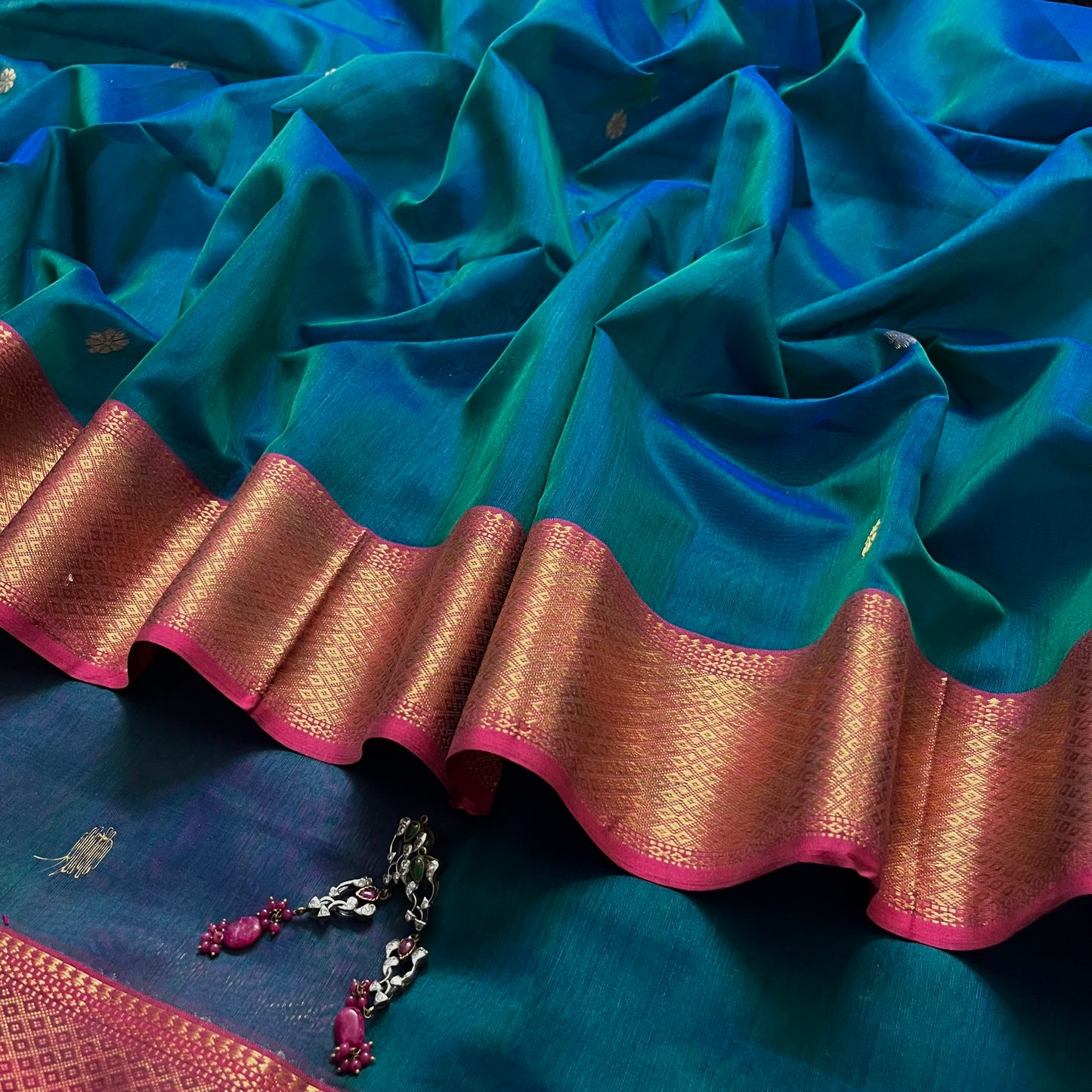 Peacock and Violet dual tone Maheshwari saree with flower motifs on pallu