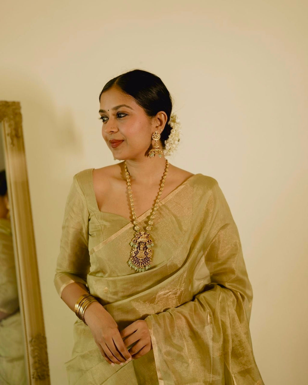Olive gold Maheshwari tissue silk saree with zari bootis all over