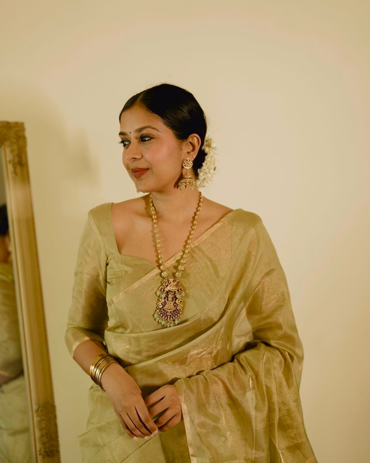 Olive gold Maheshwari tissue silk saree with zari bootis all over