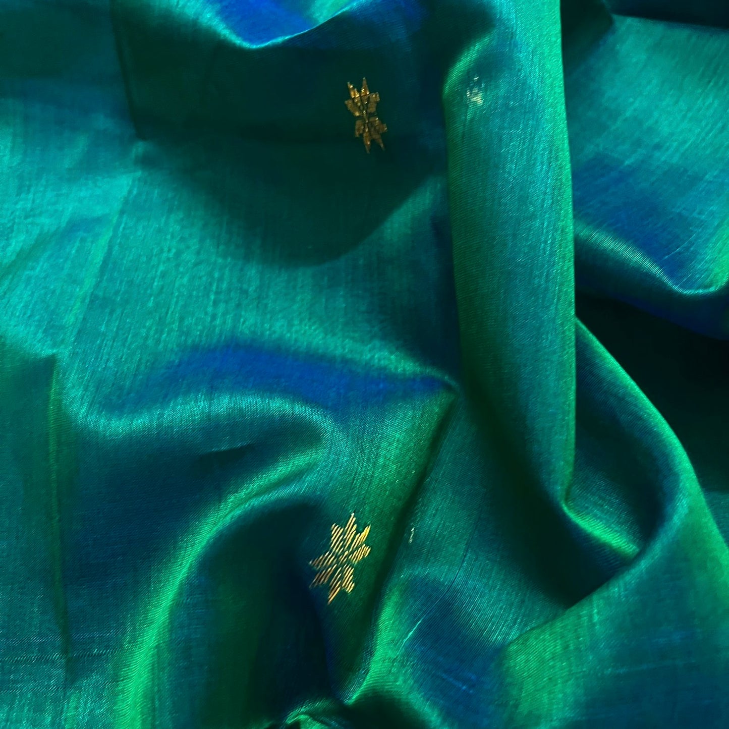 Peacock green and blue Maheshwari saree with zari border and zari bootis all over