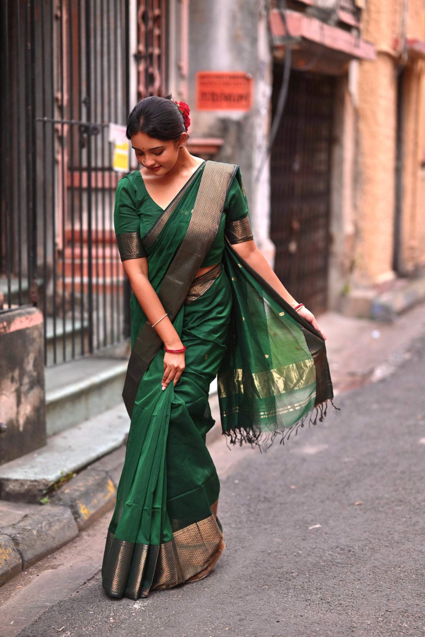 Dark green maheshwari with saree with flower bootis all over