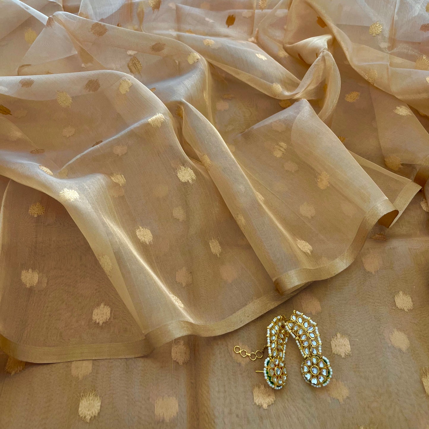 Gold Banarasi tissue silk saree with flower bootis all over