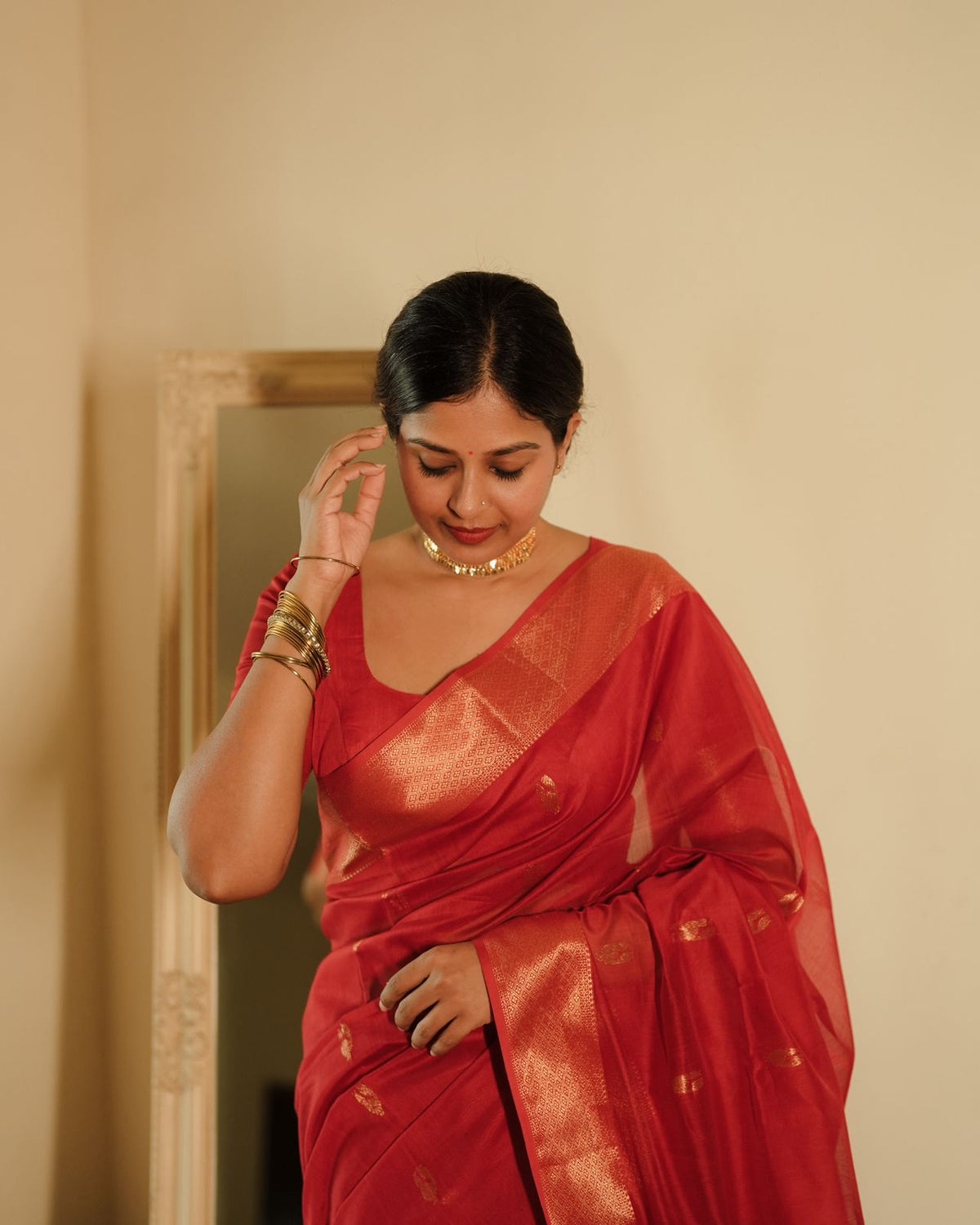 Red Maheshwari saree with morni motifs all over